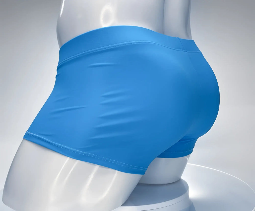 WildmanT teal square-cut swim trunks on a white mannequin, viewed from the rear, featuring a clean, fitted design.