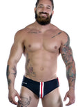 Sportivo black bikini with vertical red and white stripes down the center, worn by a smiling tattooed man.