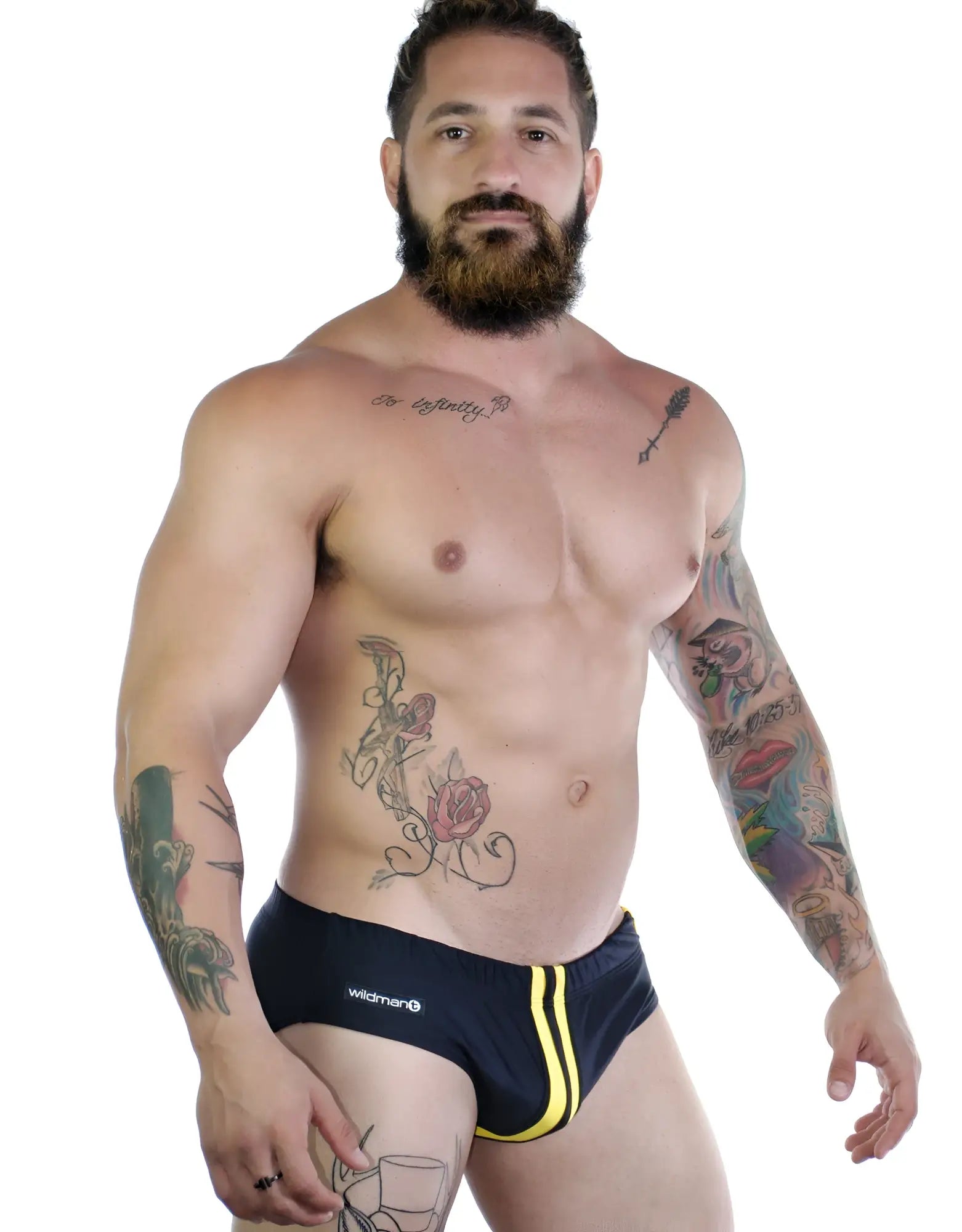 Sportivo black bikini brief with a vertical yellow stripe down the center, featuring a small Wildman brand tag.