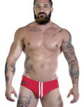 Sportivo Bikini in bright red with two vertical white stripes on the front center and a Wildman label on the hip.