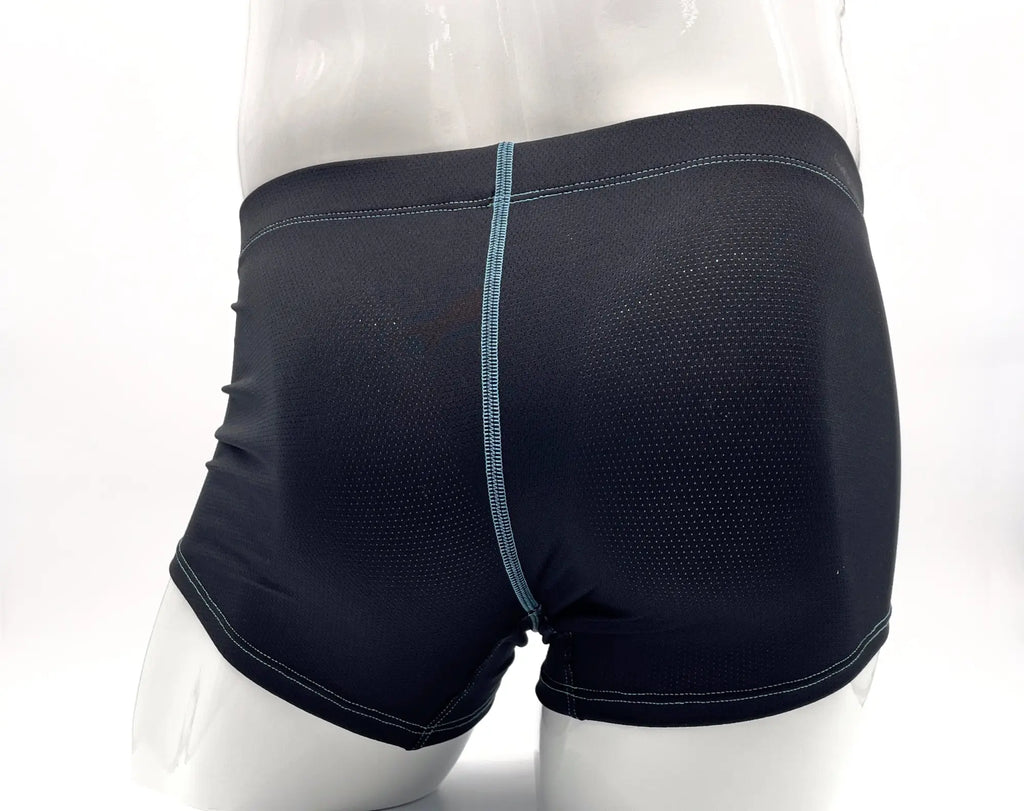Dark blue, perforated fabric boxer briefs on a mannequin with contrasting light blue stitching detail.