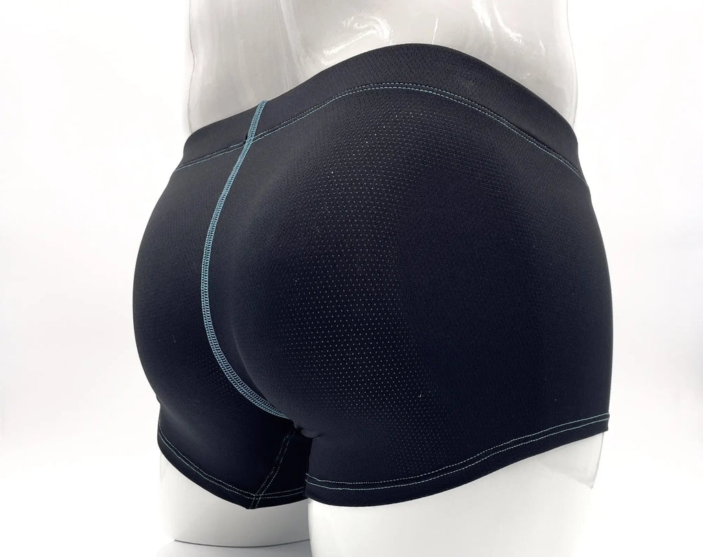 Back view of black perforated boxer briefs with contrast light blue stitching on a mannequin.