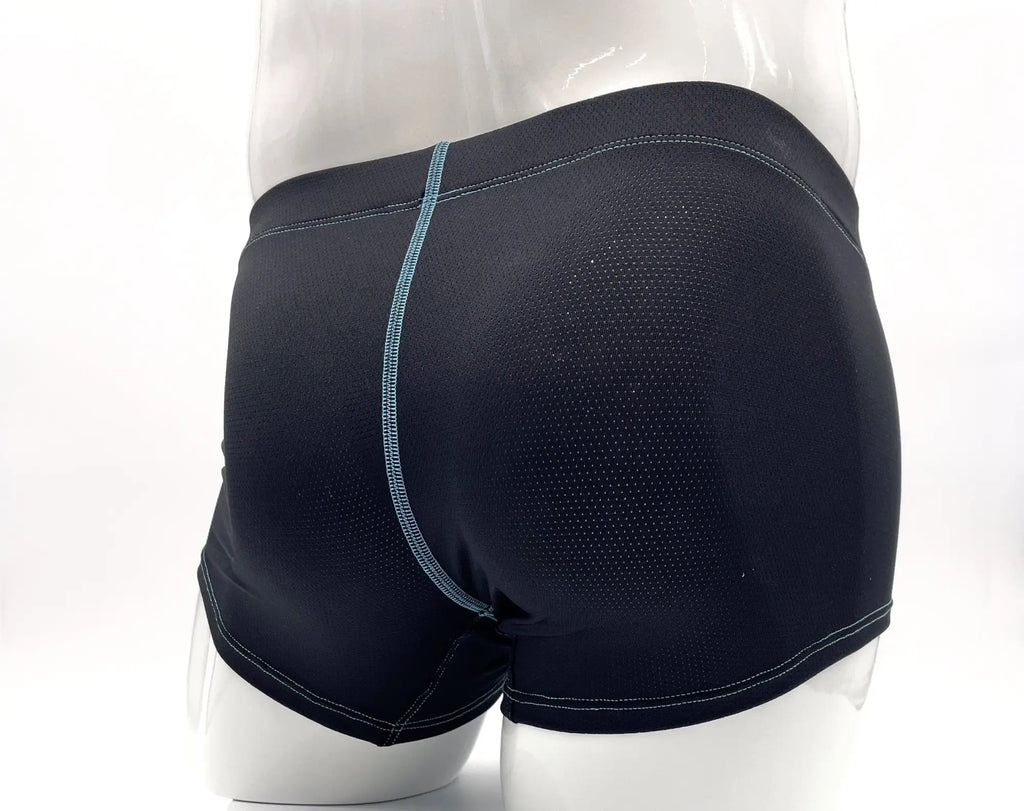 Back view of black perforated boxer briefs with blue contrast stitching on a mannequin.