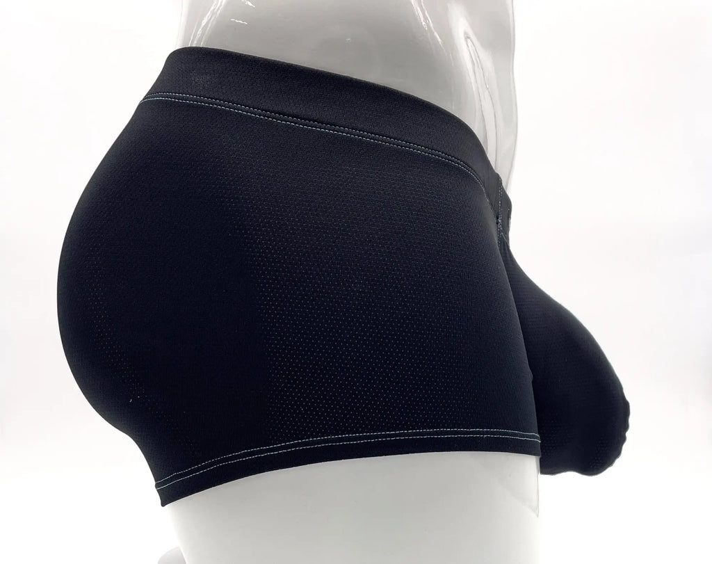 Blue boxer briefs with a textured fabric, a prominent front pouch, and visible light blue stitching on a mannequin.
