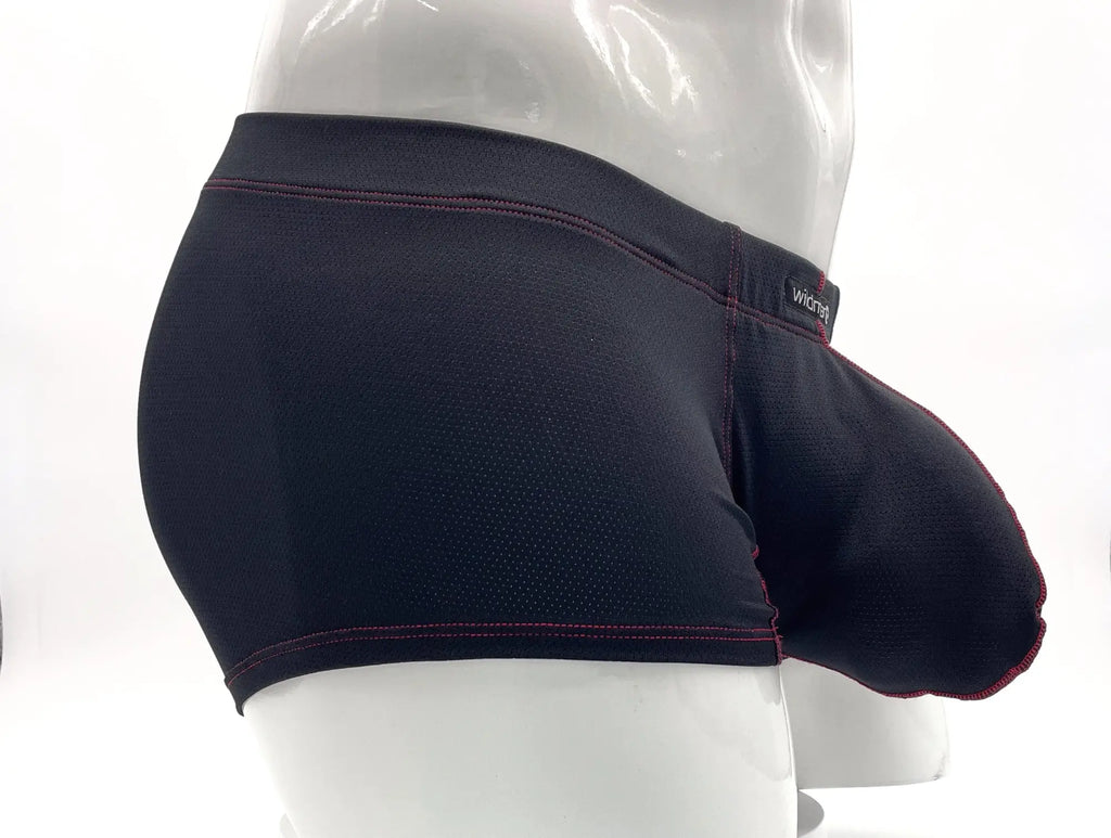 Black mesh boxer brief with a large pouch, red contrast stitching, and a branded waistband on a mannequin torso.