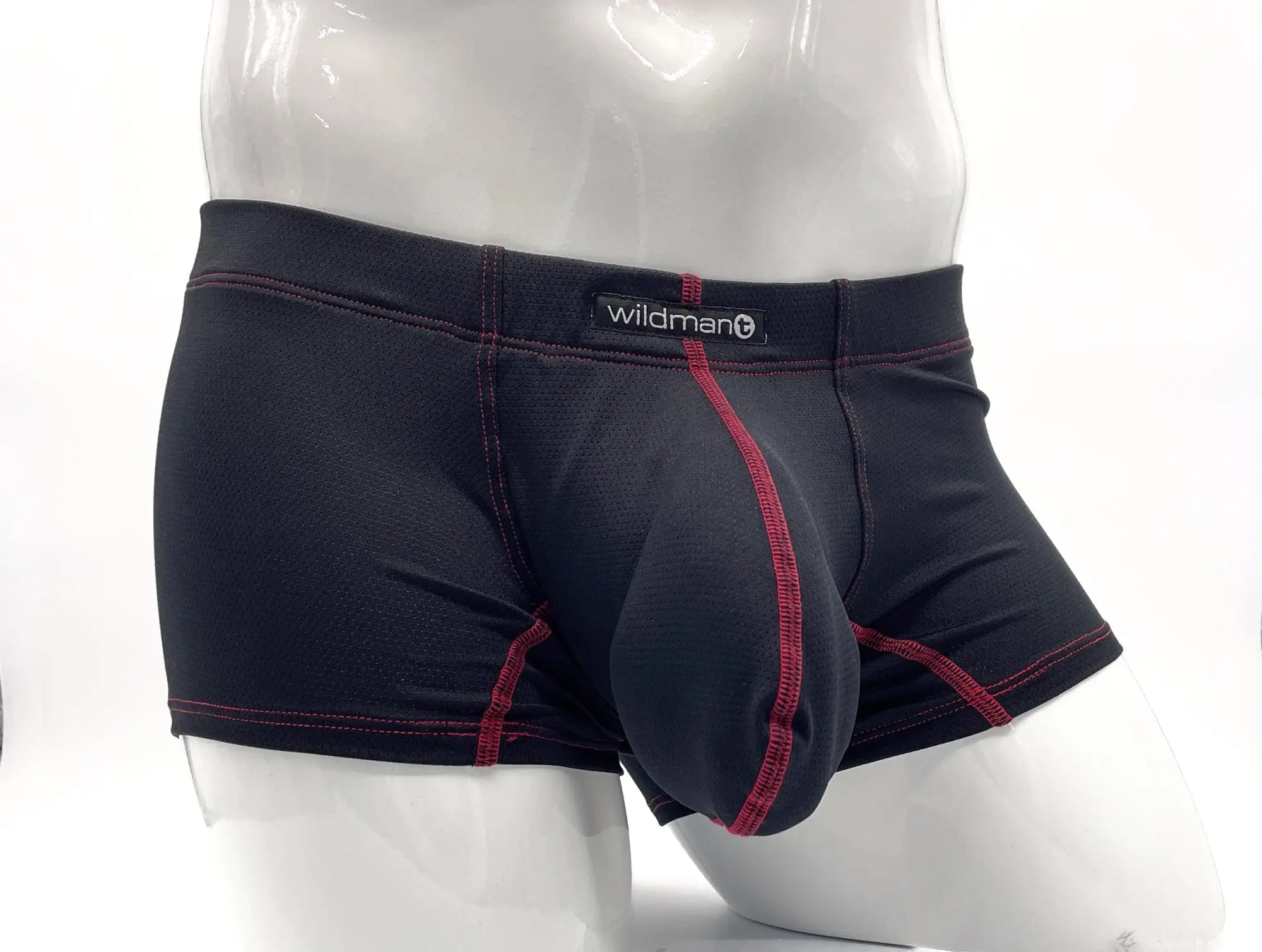 Black textured boxer briefs with red contrast stitching, prominent front pouch, and "wildmant" label on waistband.
