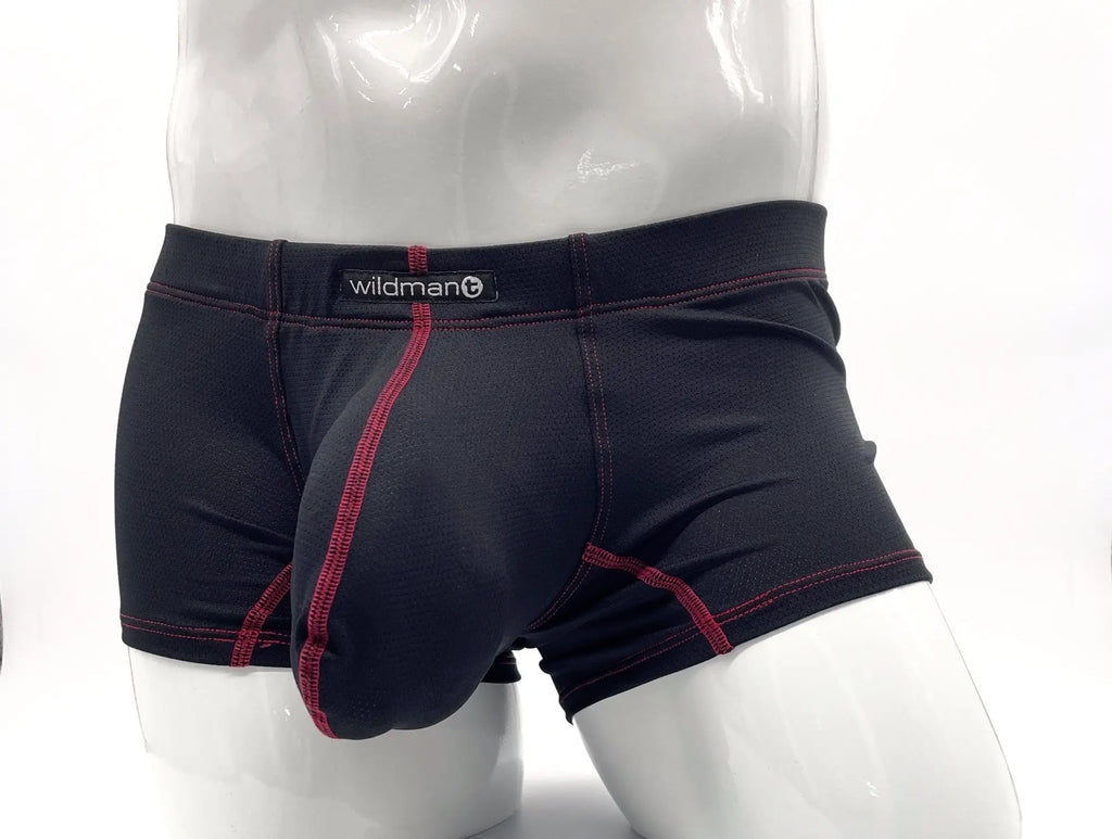 Black boxer briefs with a red-stitched contoured pouch and WildmanT waistband logo on a white mannequin torso.