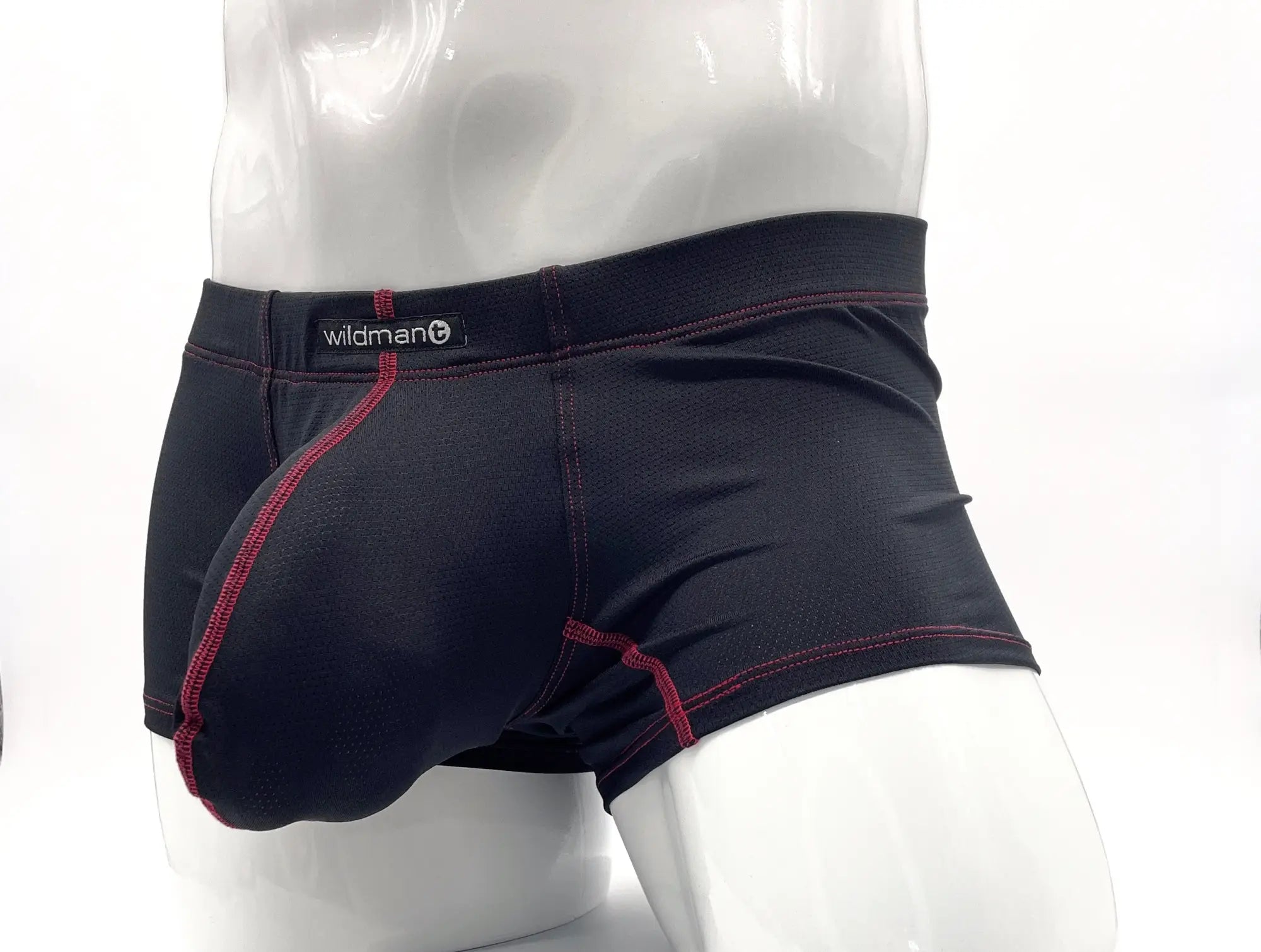 Black boxer briefs with red contrast stitching, a contoured front pouch, and "wildman" logo on the waistband.