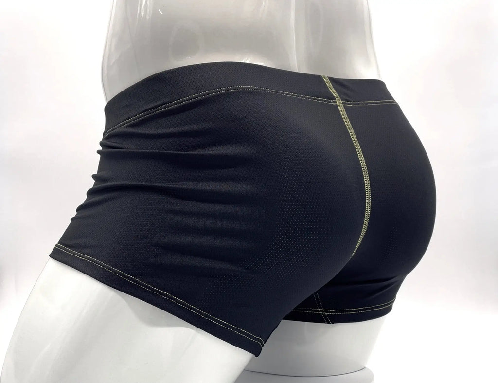 Black performance boxer briefs with visible yellow stitching on a mannequin, shown from the side and back.