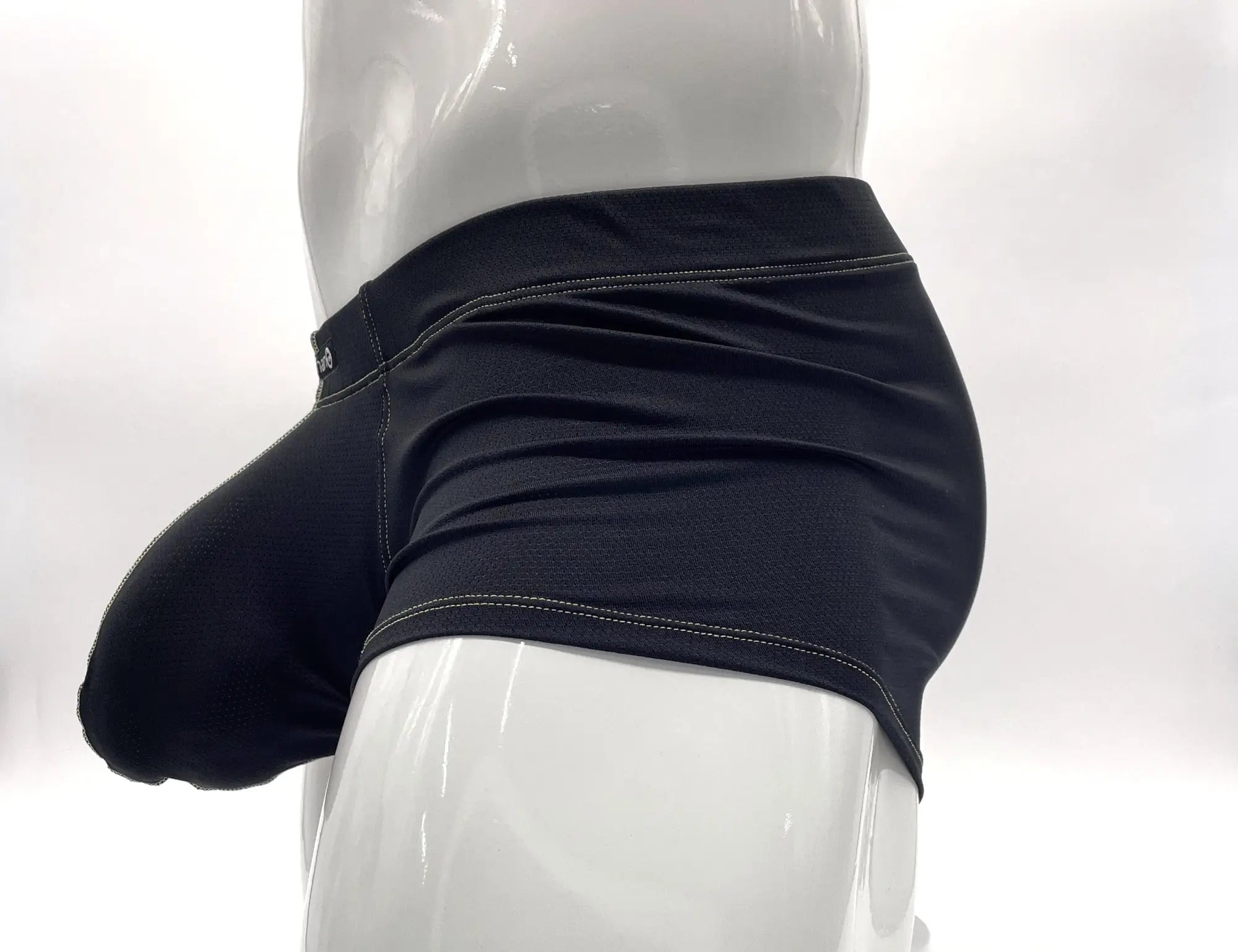 Black Big Boy pouch boxer briefs on a white mannequin, featuring yellow contrast stitching and a side-profile view.