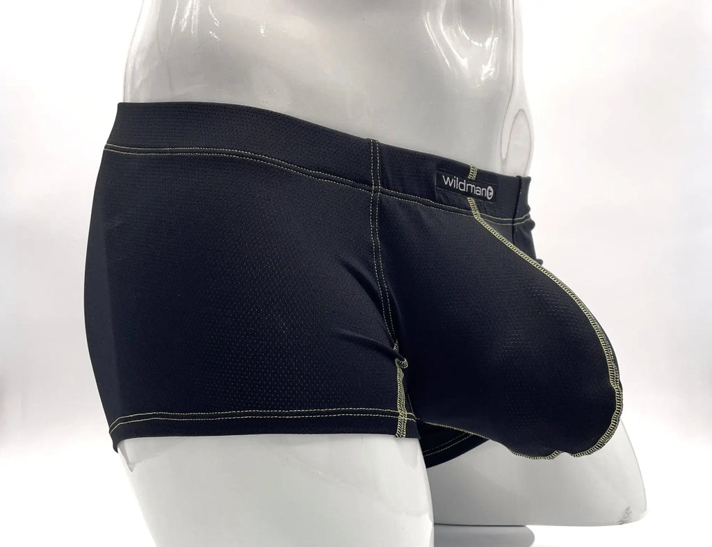 Black boxer briefs with a prominent front pouch, yellow contrast stitching, and "wildman" logo on a white mannequin.