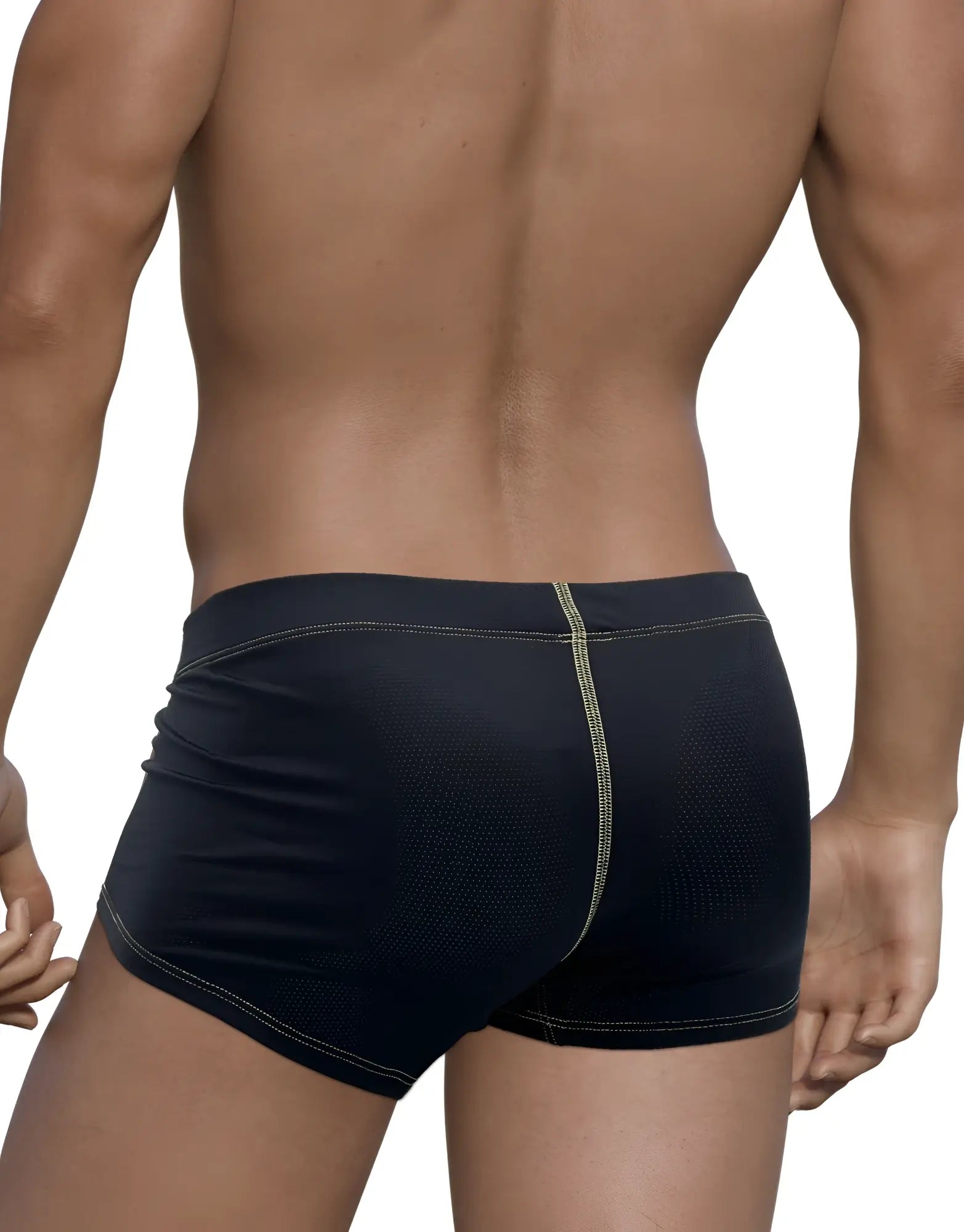 Back view of black perforated boxer briefs with yellow contrast stitching on a muscular man.