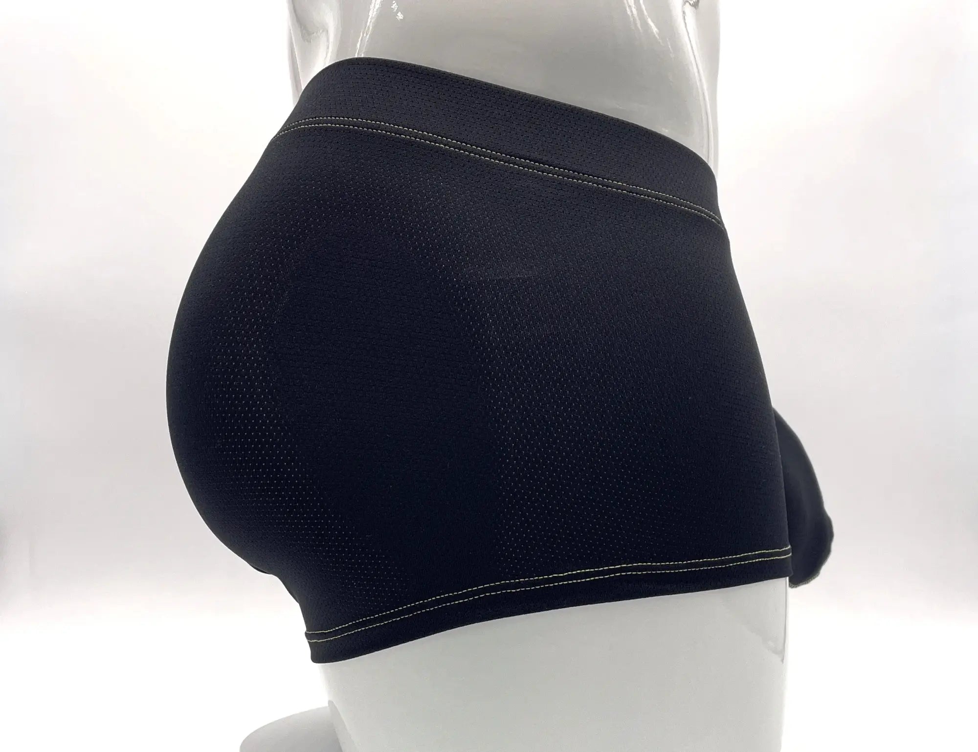 Black mesh boxer brief on a mannequin, featuring contrast yellow stitching along the waistband and leg openings.