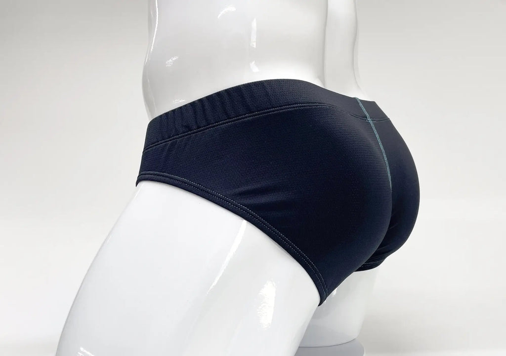 Stitch Big Boy Pouch Brief in navy blue on a white mannequin, showing back view with contrast teal stitching.