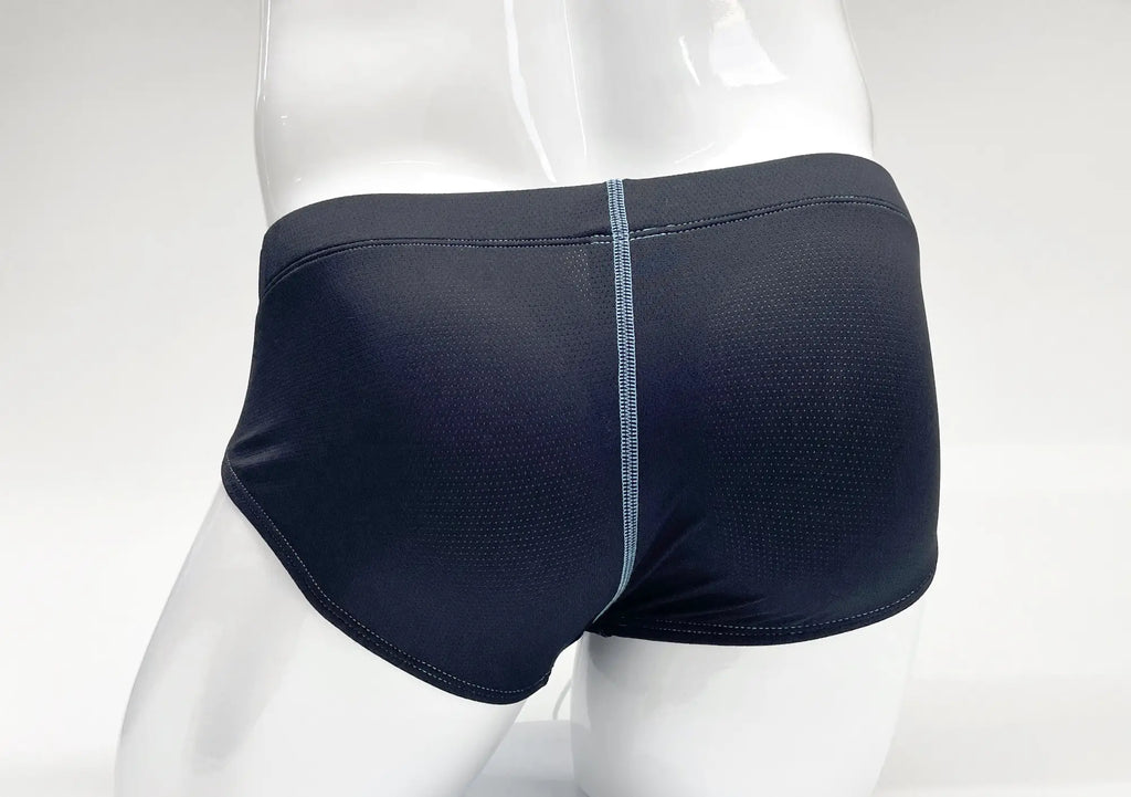 Blue, perforated-fabric brief on a white mannequin, featuring a contrasting light blue vertical center stitch.