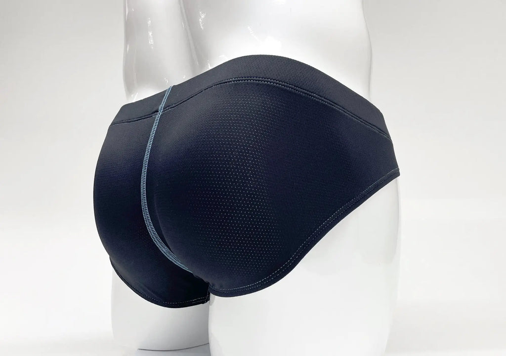 Stitch Big Boy Pouch Brief in navy blue, featuring perforated fabric and a contrasting light blue center-back seam.