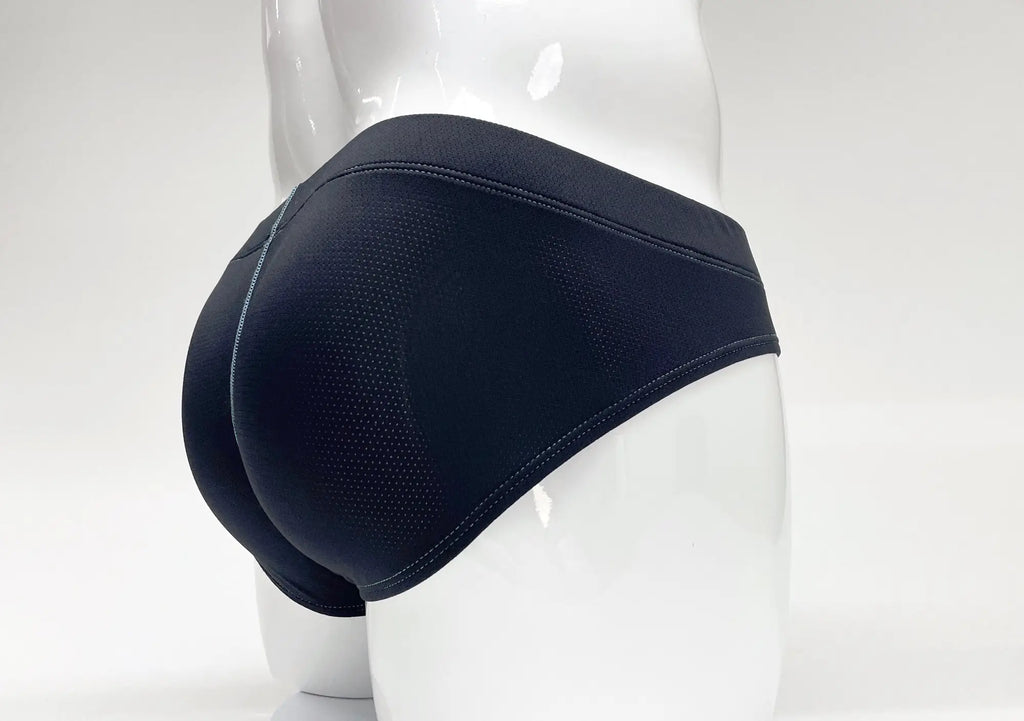 Back view of a blue Stitch Big Boy pouch brief on a white mannequin, featuring micro-perforated fabric and stitching.