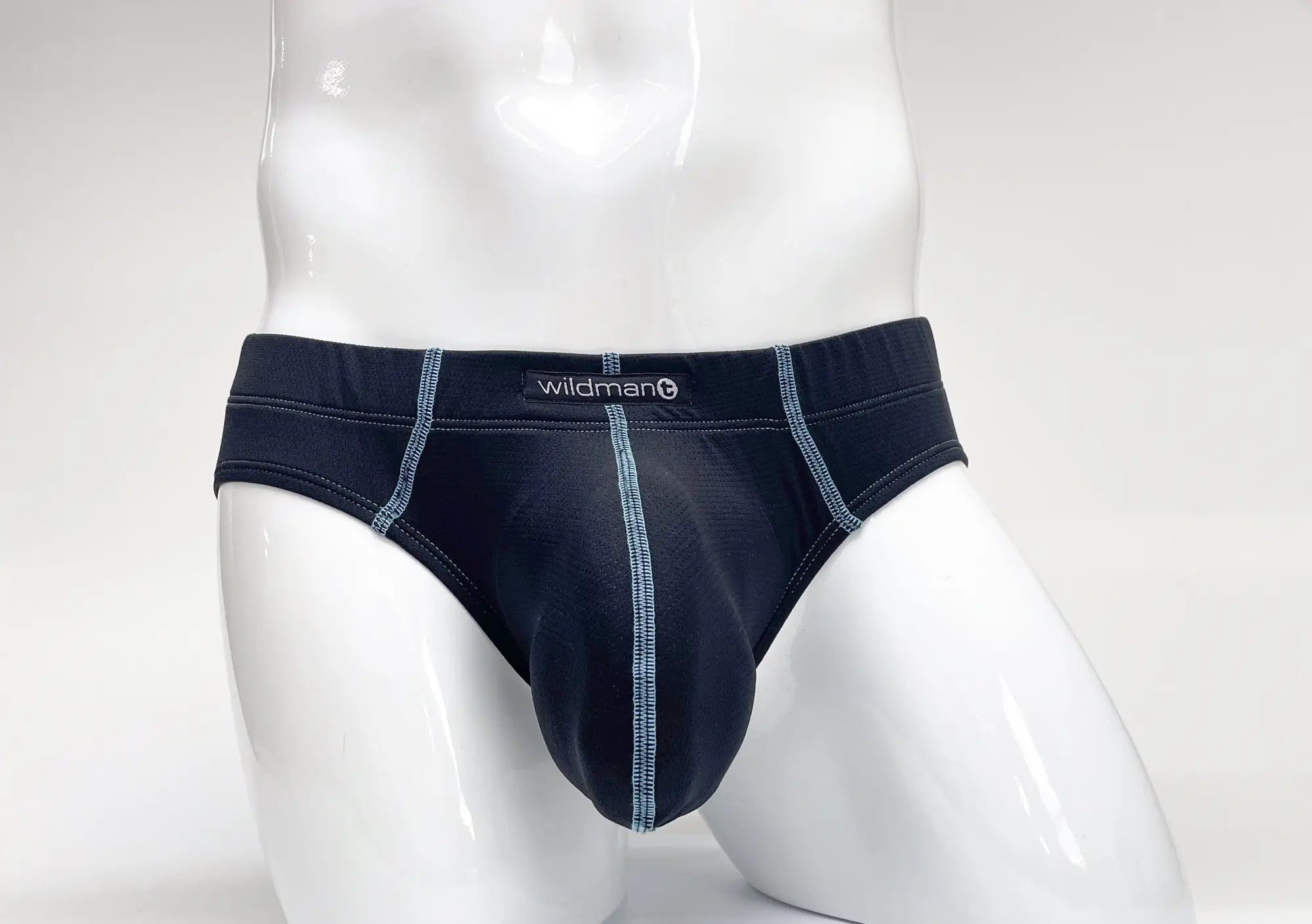 Navy blue Stitch Big Boy pouch brief on a white mannequin, featuring contrast light blue stitching and Wildman logo.