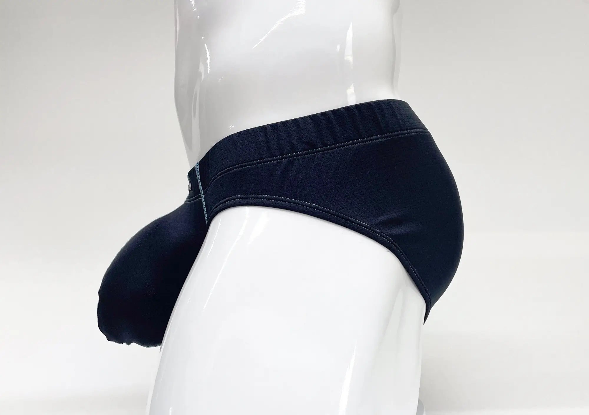 Blue Stitch Big Boy pouch brief on a white mannequin, featuring a prominent front pouch and side stitching detail.