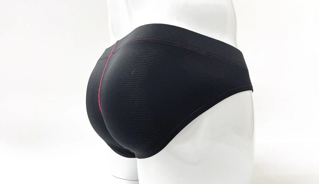 Black perforated fabric pouch briefs on a mannequin, featuring red contrast stitching details.