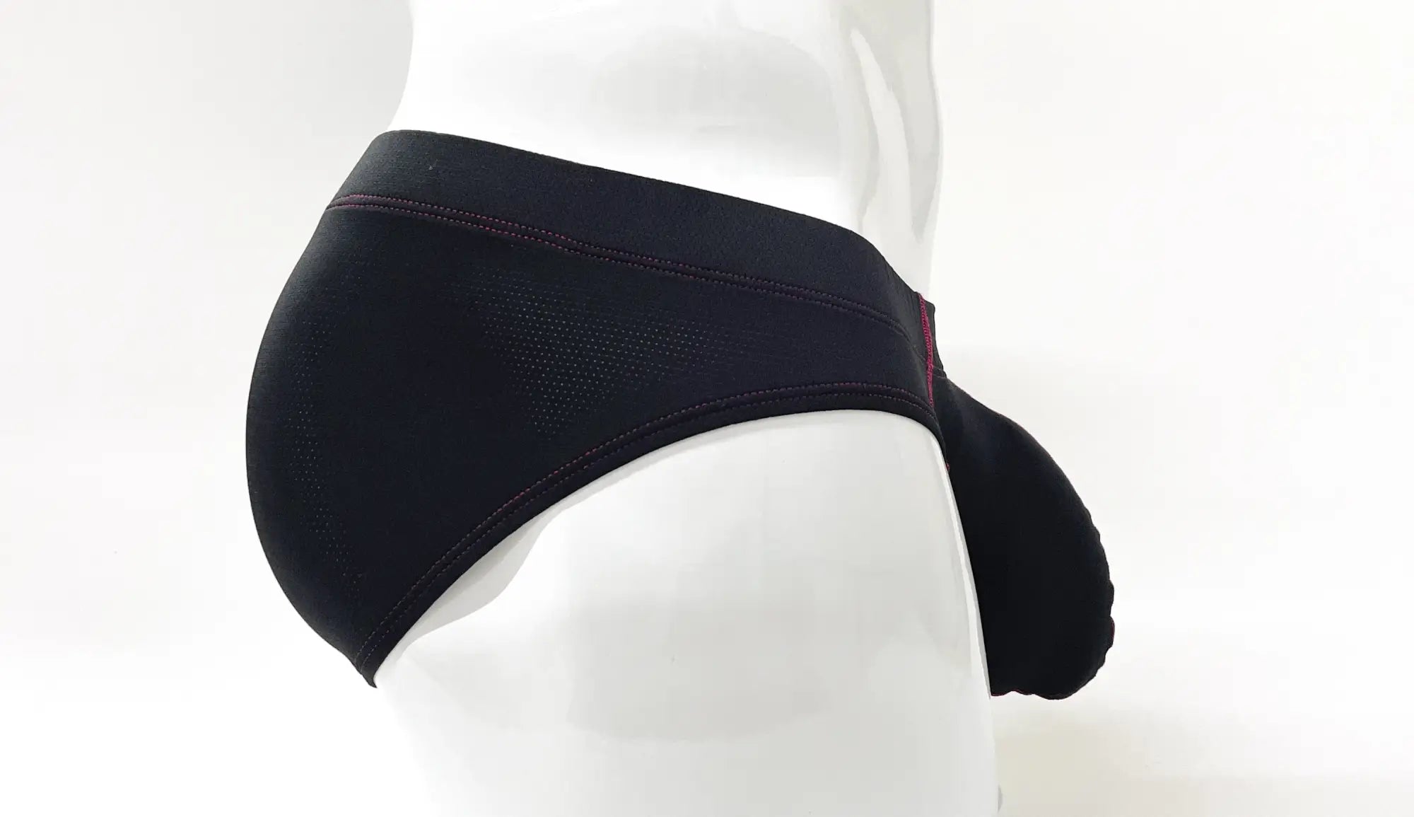 Black Stitch Big Boy pouch brief with perforated fabric and contrast red stitching on a mannequin.