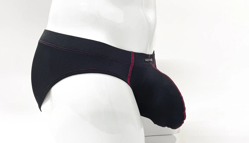 Stitch Big Boy Pouch Brief in black with red contrast stitching, shown from the side on a white mannequin.