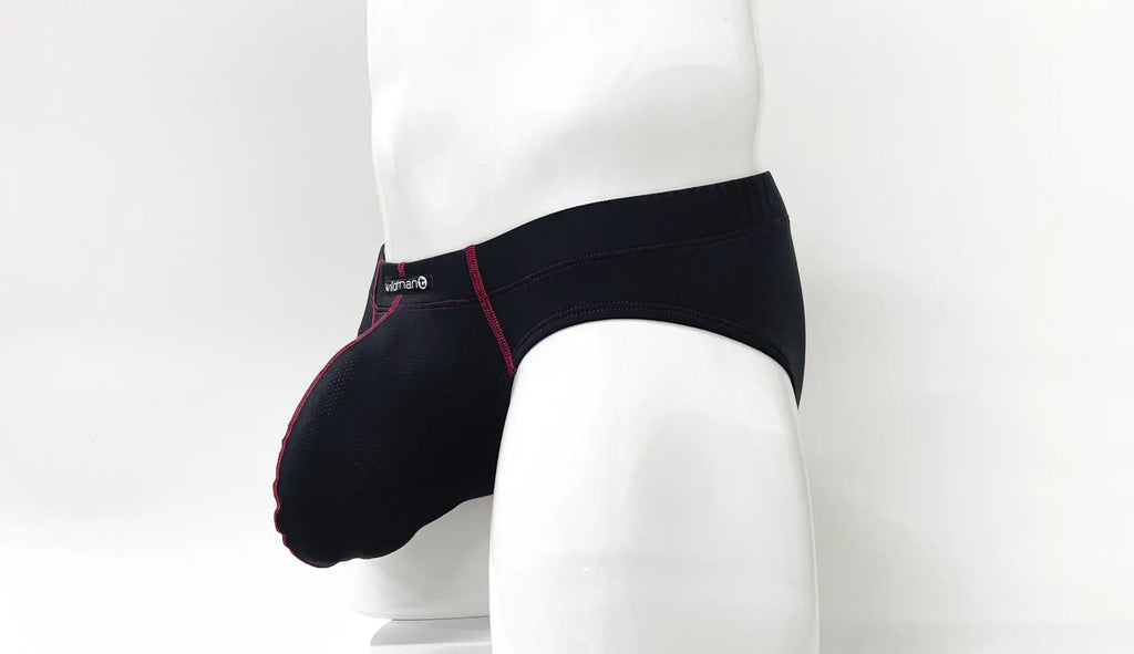 Black pouch brief with red contrast stitching and a small logo on the waistband, shown on a white mannequin.