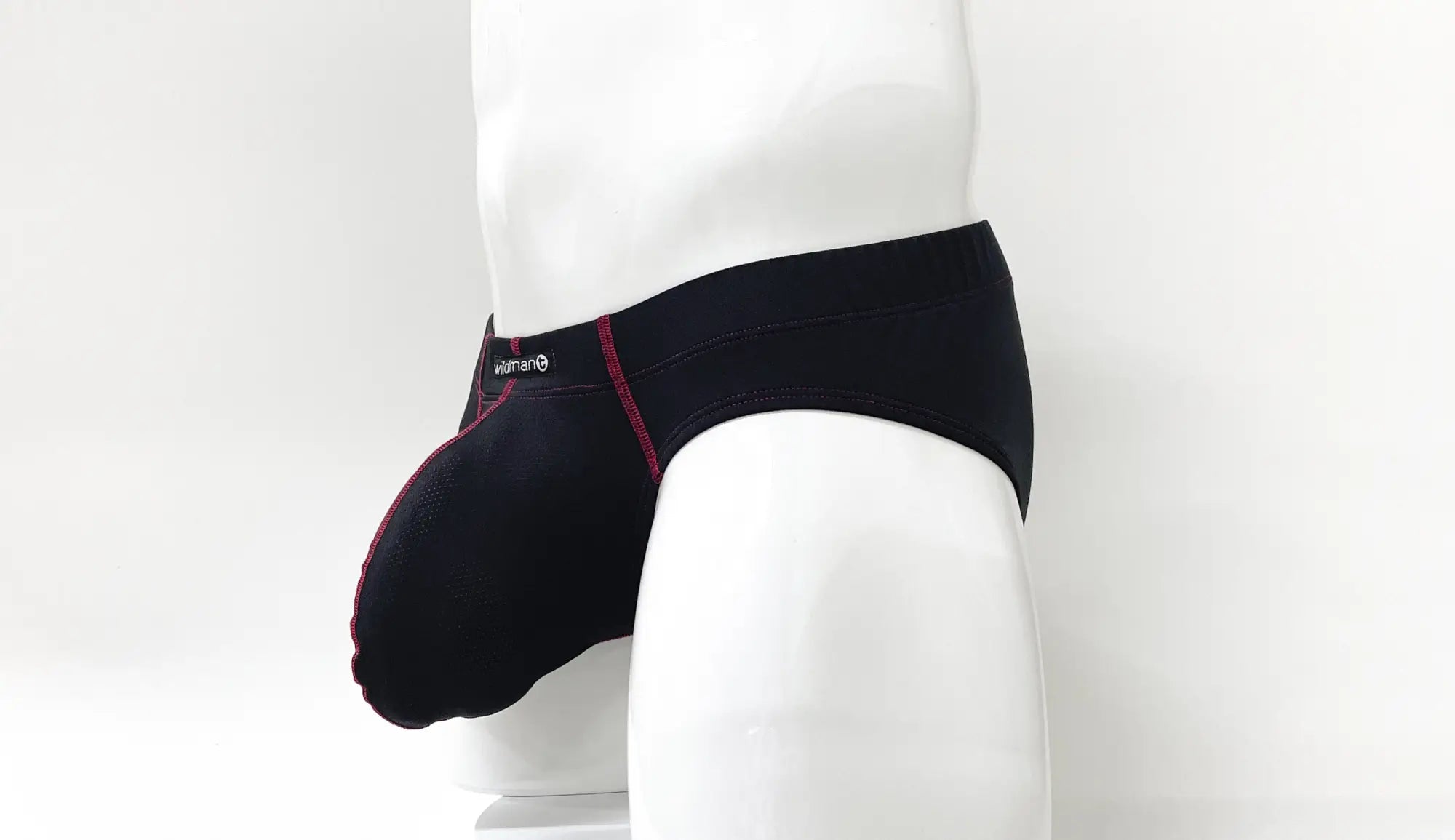 Black pouch brief with red contrast stitching and a small logo on the waistband, shown on a white mannequin.