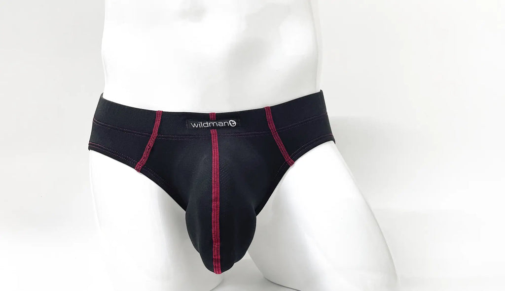 Stitch Big Boy Pouch Brief in black with red contrast stitching and a WildmanT logo on a white mannequin.