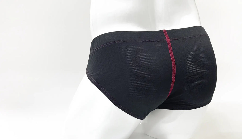Black mesh Big Boy pouch brief with red contrast stitching, shown from the back on a mannequin.