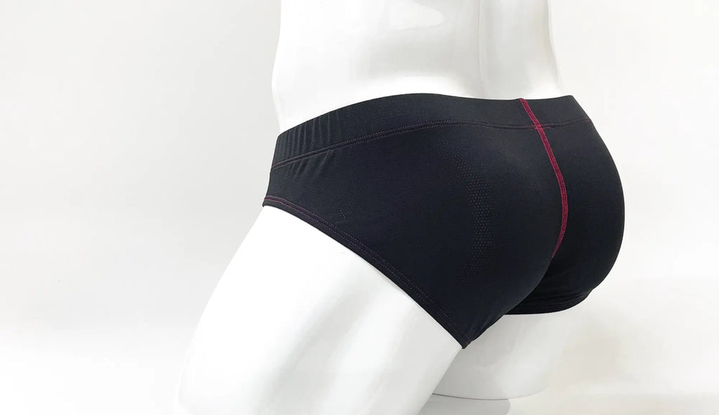 Back view of black Stitch Big Boy pouch briefs on a white mannequin with red contrast stitching.