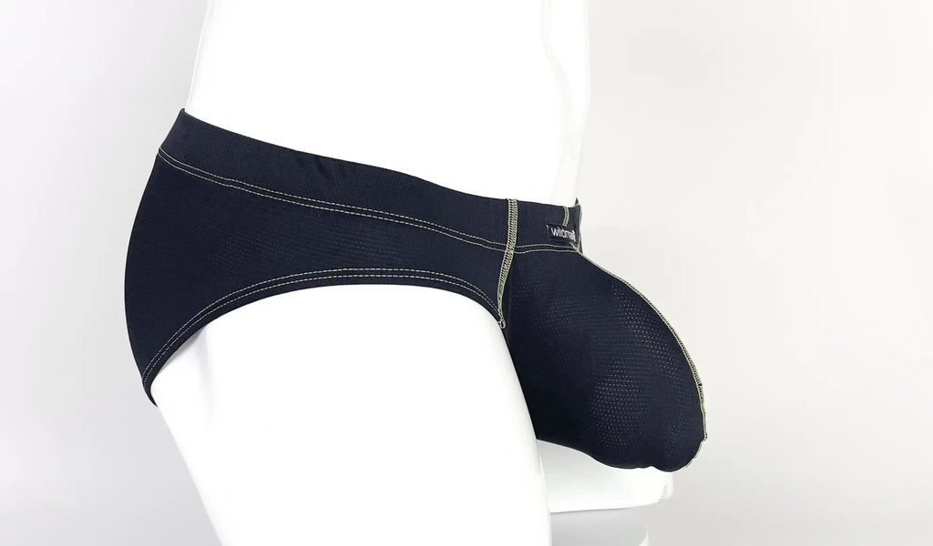 Side view of a black pouch brief with yellow contrast stitching on a white mannequin.