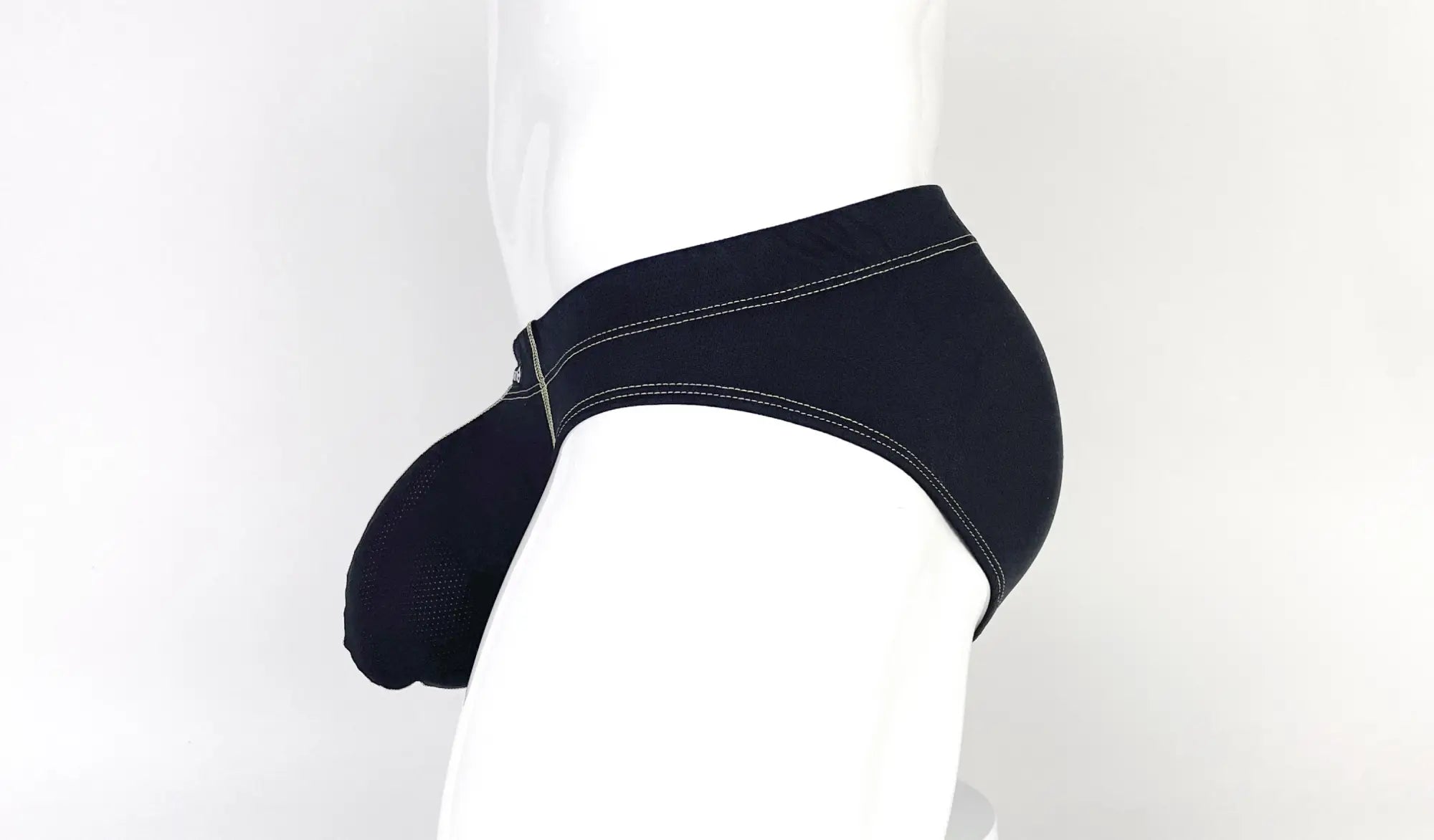 Black pouch brief with yellow contrast stitching on a white mannequin.