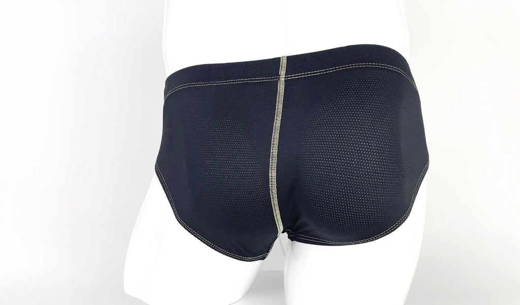 Black mesh pouch briefs on a mannequin with prominent, light-colored contrast stitching.