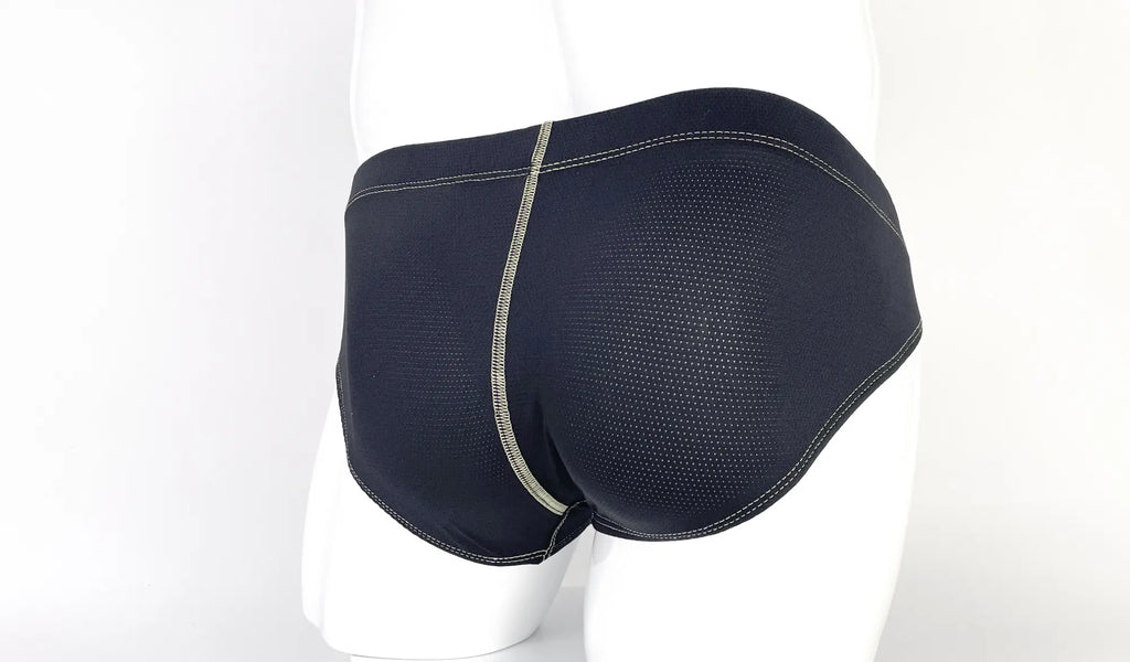 Back view of black, perforated fabric pouch briefs featuring prominent, light-colored decorative stitching.