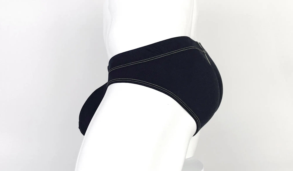 Side view of a black pouch brief with contrasting yellow stitching on a white mannequin.