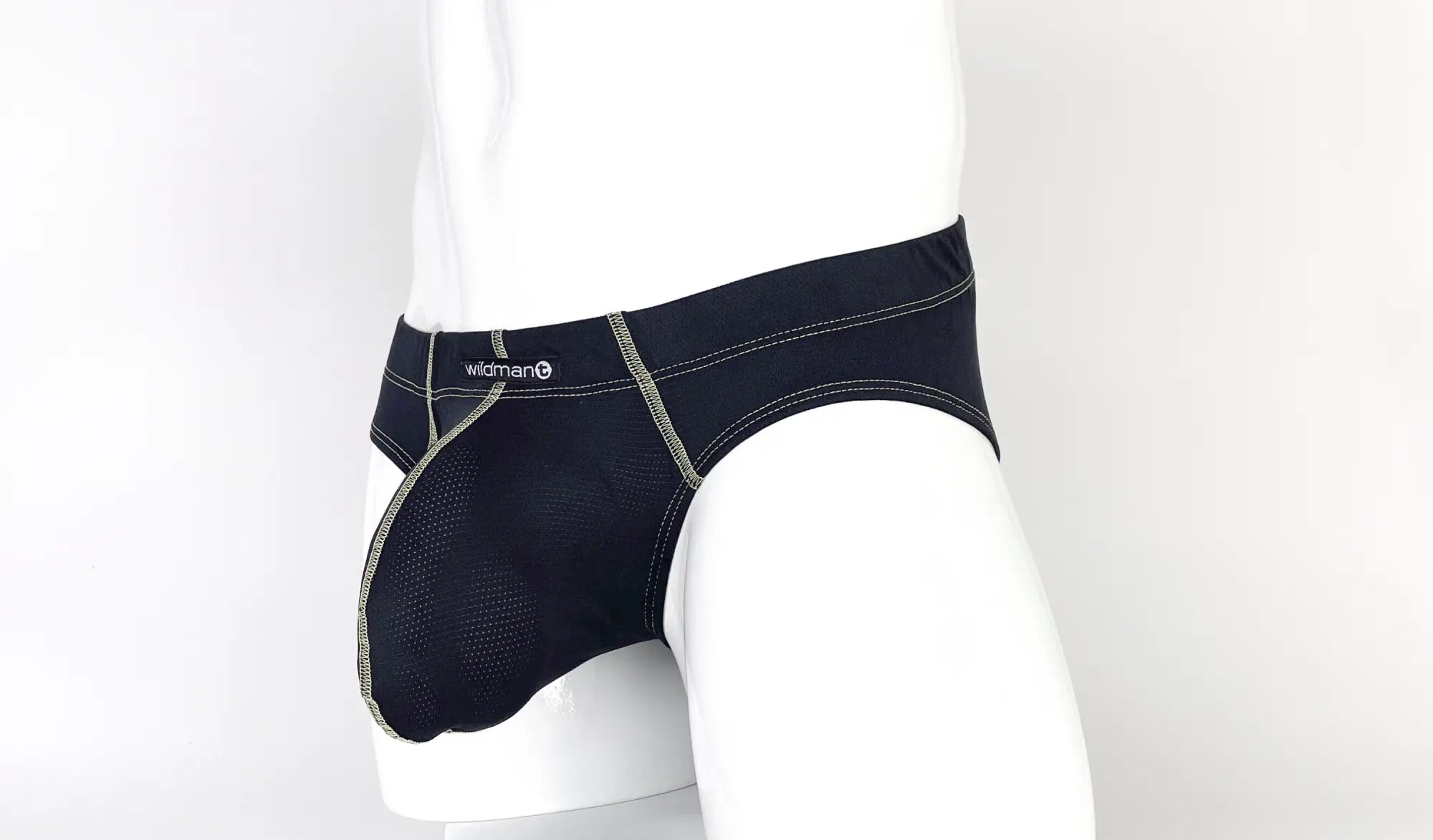 Black mesh Big Boy pouch brief with yellow contrast stitching and WildmanT logo on a white mannequin torso.