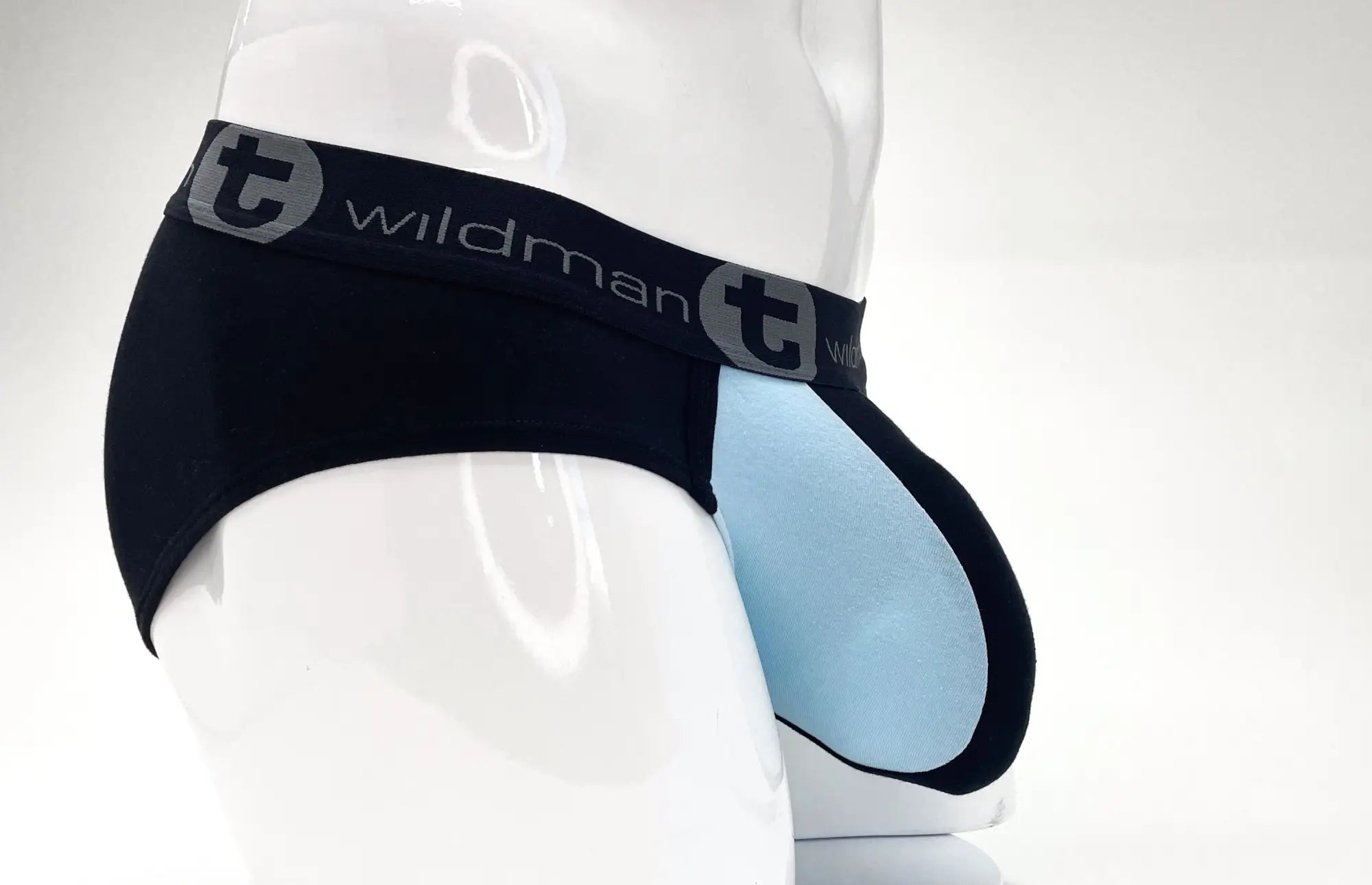 Black and light blue stretch cotton pouch brief on a mannequin, featuring a black waistband with WildmanT branding.