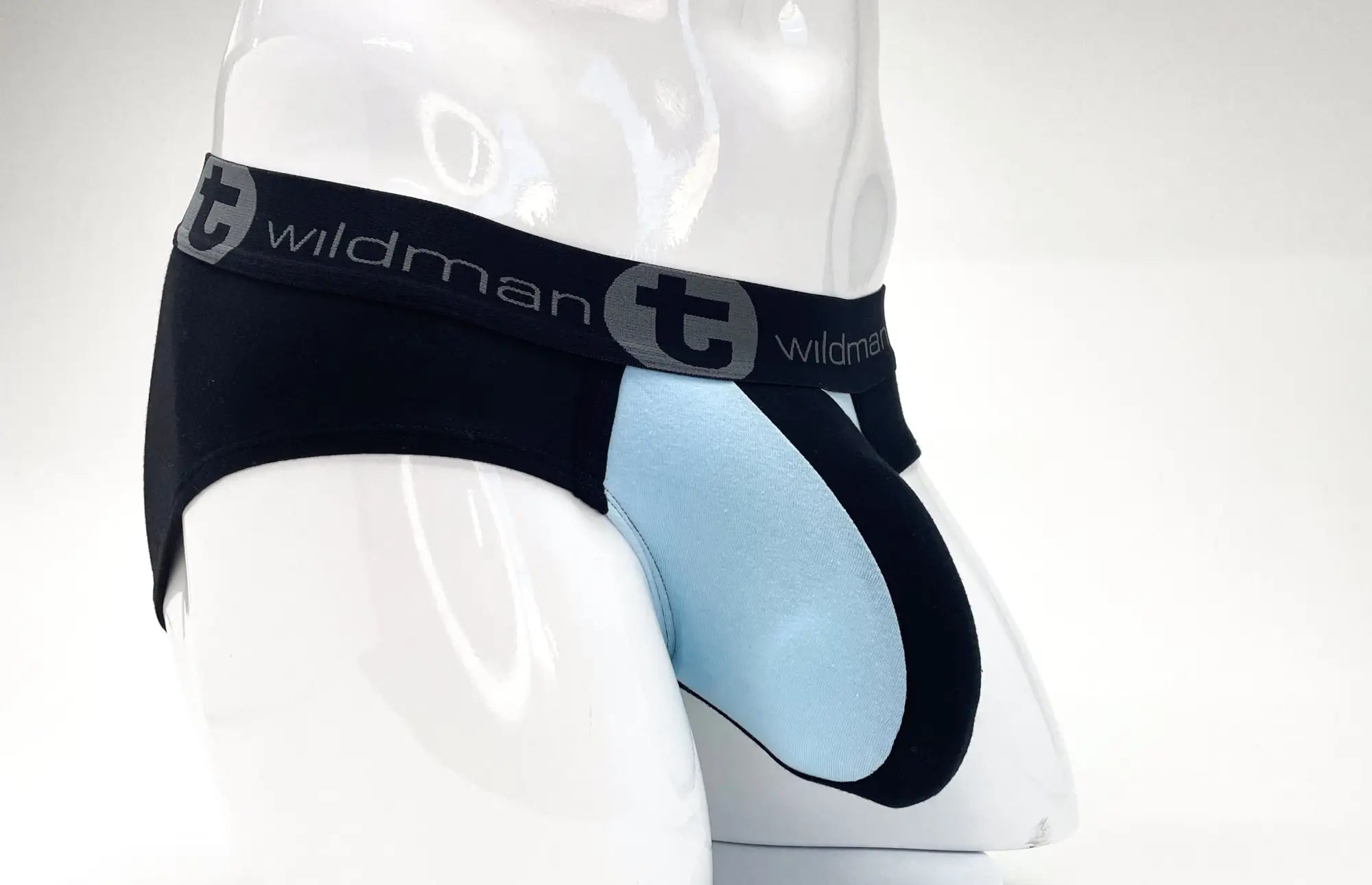 Black and light blue stretch cotton pouch brief on a mannequin, featuring a branded waistband with "wildman" logo.