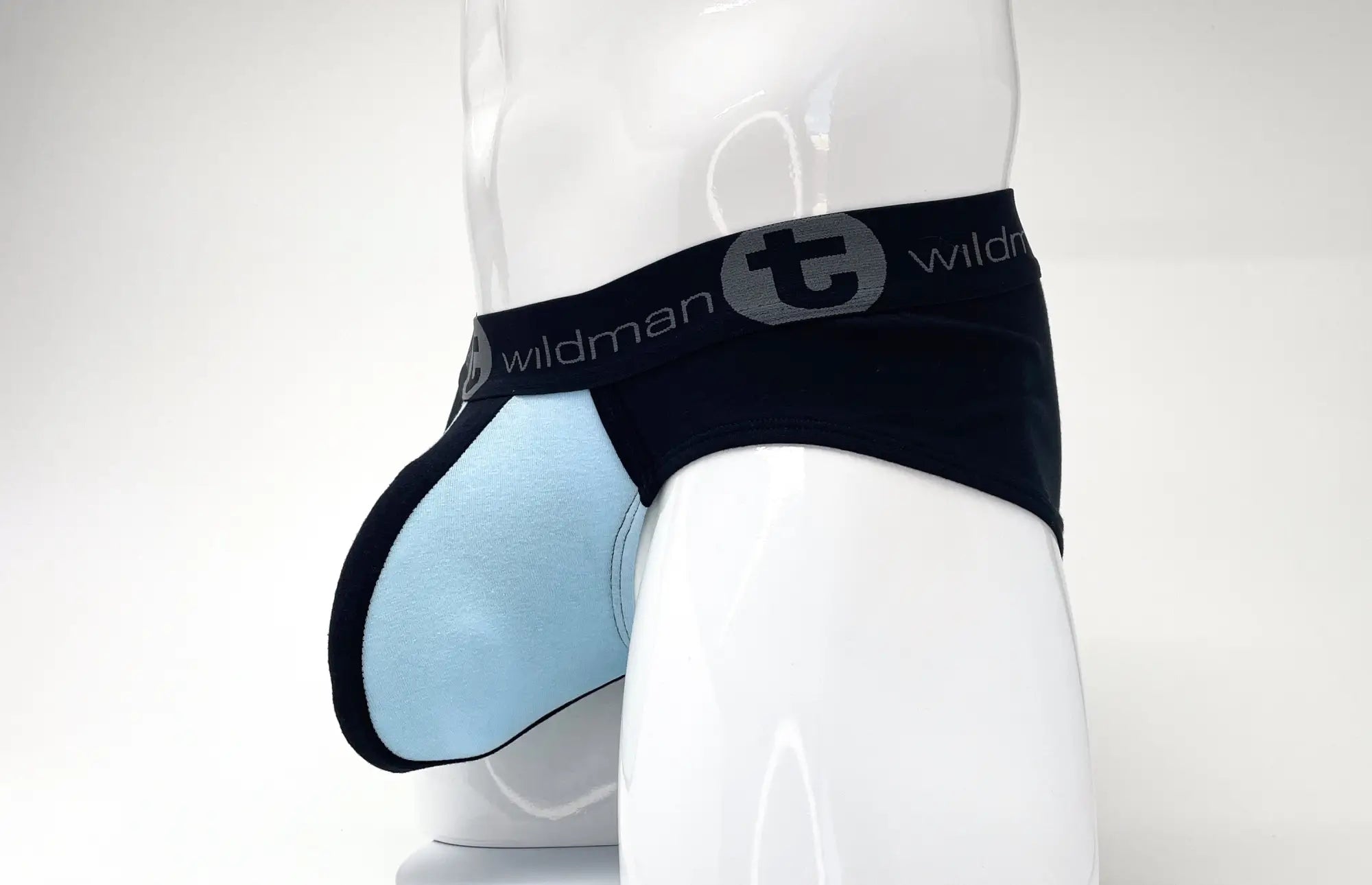 Black and light blue pouch brief on a mannequin with a black waistband featuring the "Wildman" logo.