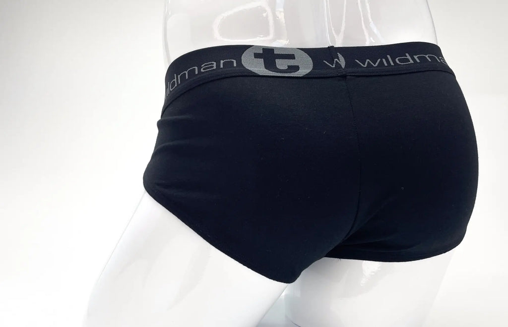 Back view of black stretch cotton pouch briefs on a mannequin, featuring a grey waistband with "wildman" branding.