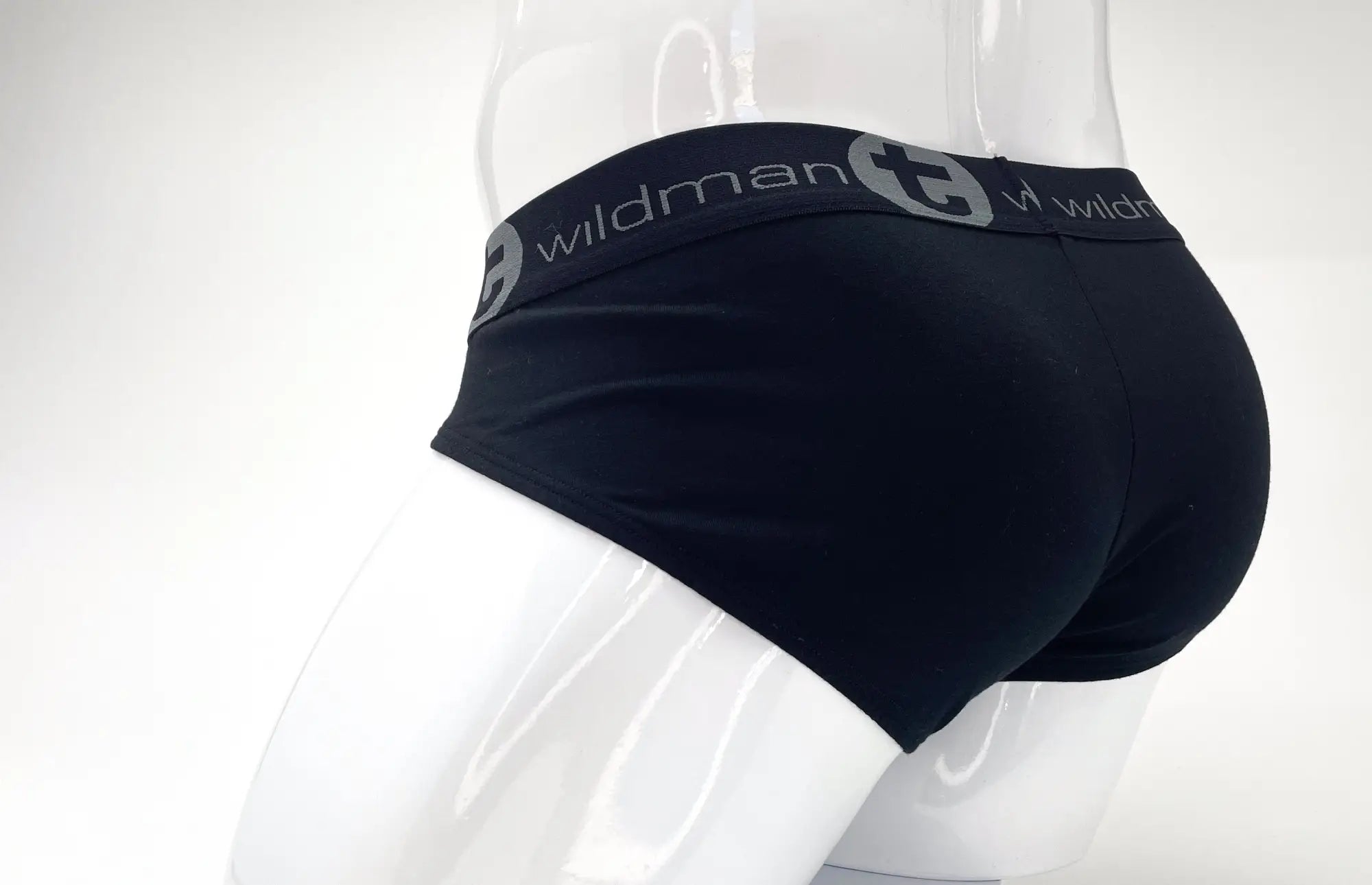 Black stretch cotton brief on a mannequin, featuring a branded "wildman" elastic waistband with grey lettering.