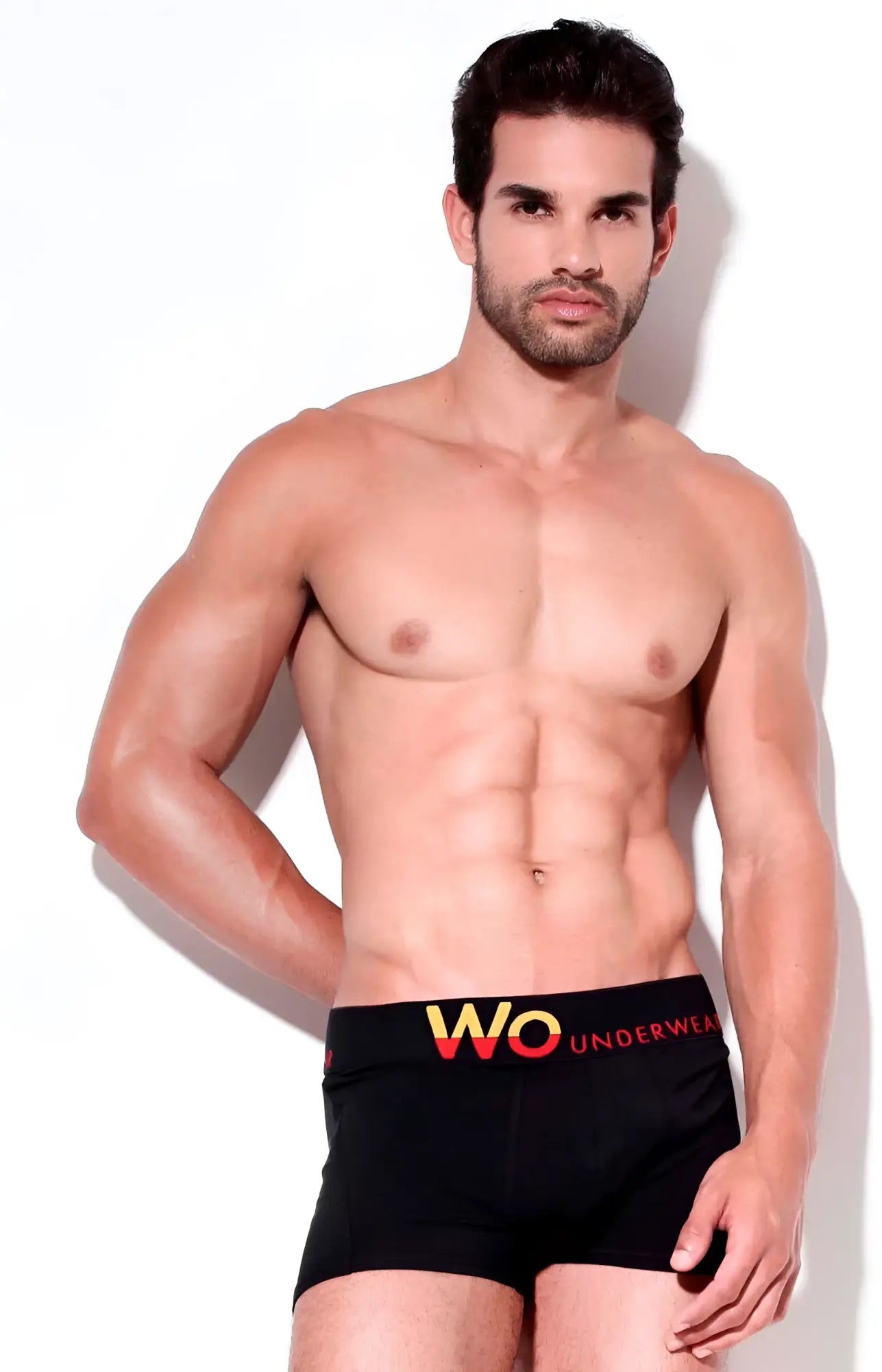 Wo underwear solid boxer briefs in black with bold yellow and red waistband logo size m front view