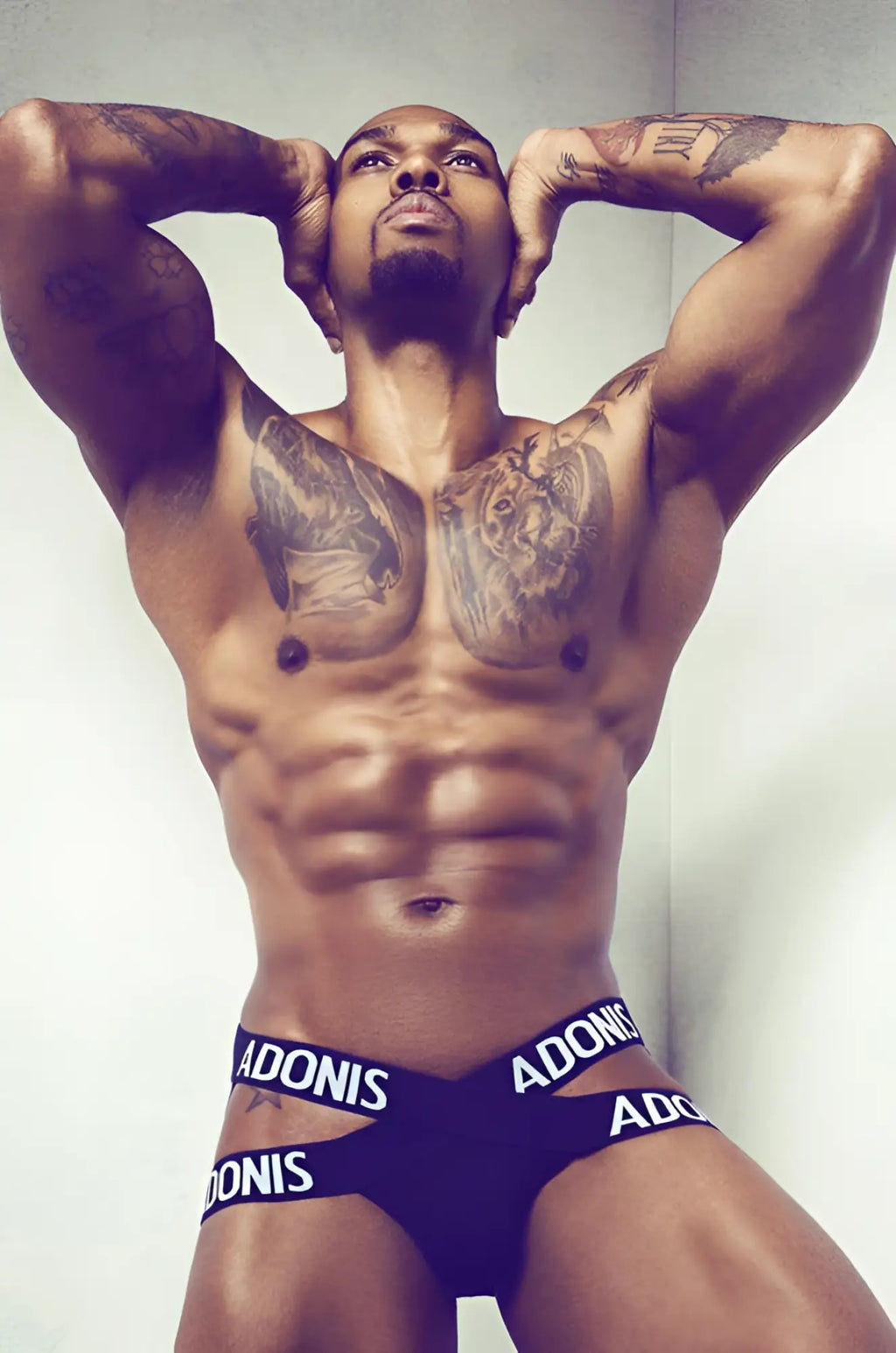 Dark blue athletic briefs x black jock with white adonis branding on waistband designed for performance wear