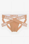 Beige adonis brand briefs with white adonis lettering on intersecting elastic bands from the x nude jock collection