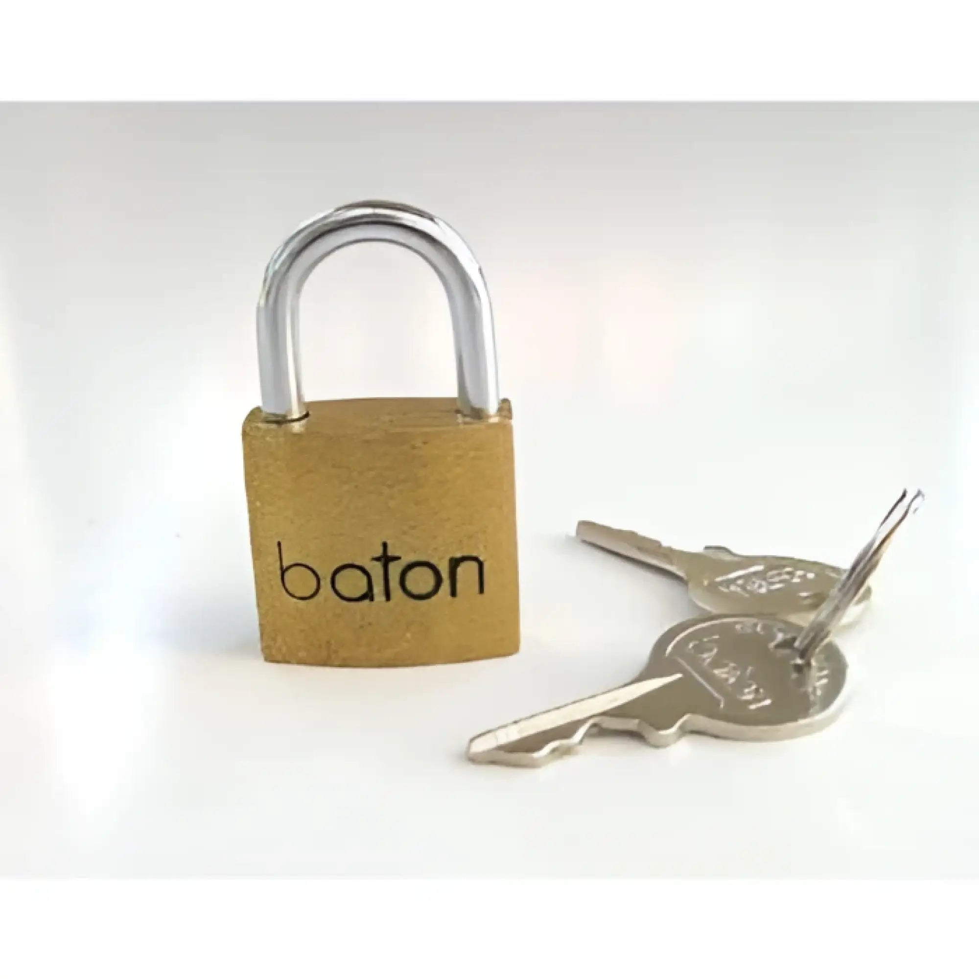 XR Brands Brass Baton padlock with a silver shackle and two matching metal keys, isolated against a white background.