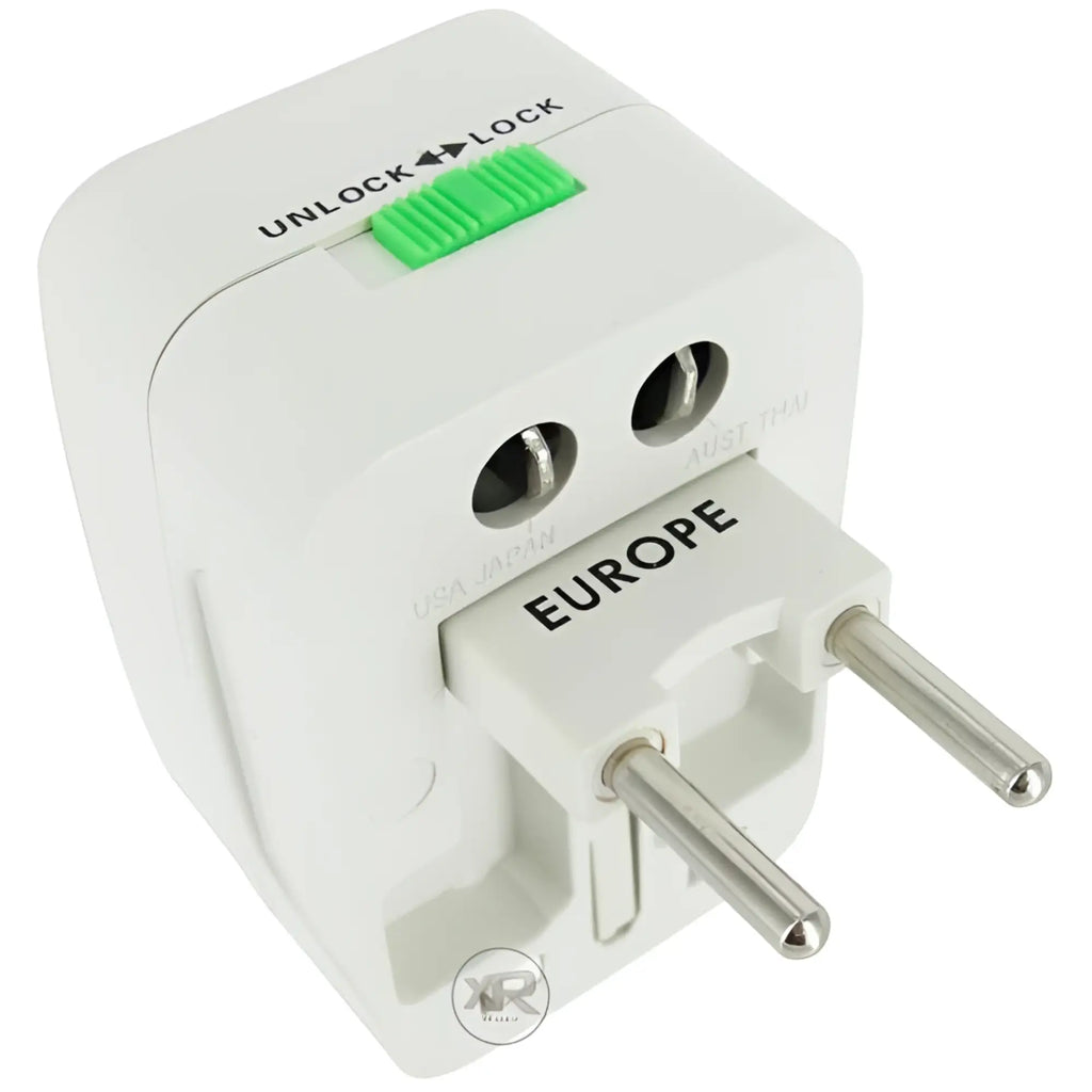 White XR Brands universal travel plug adapter with a green unlock/lock slider switch, shown with Europe prongs extended.