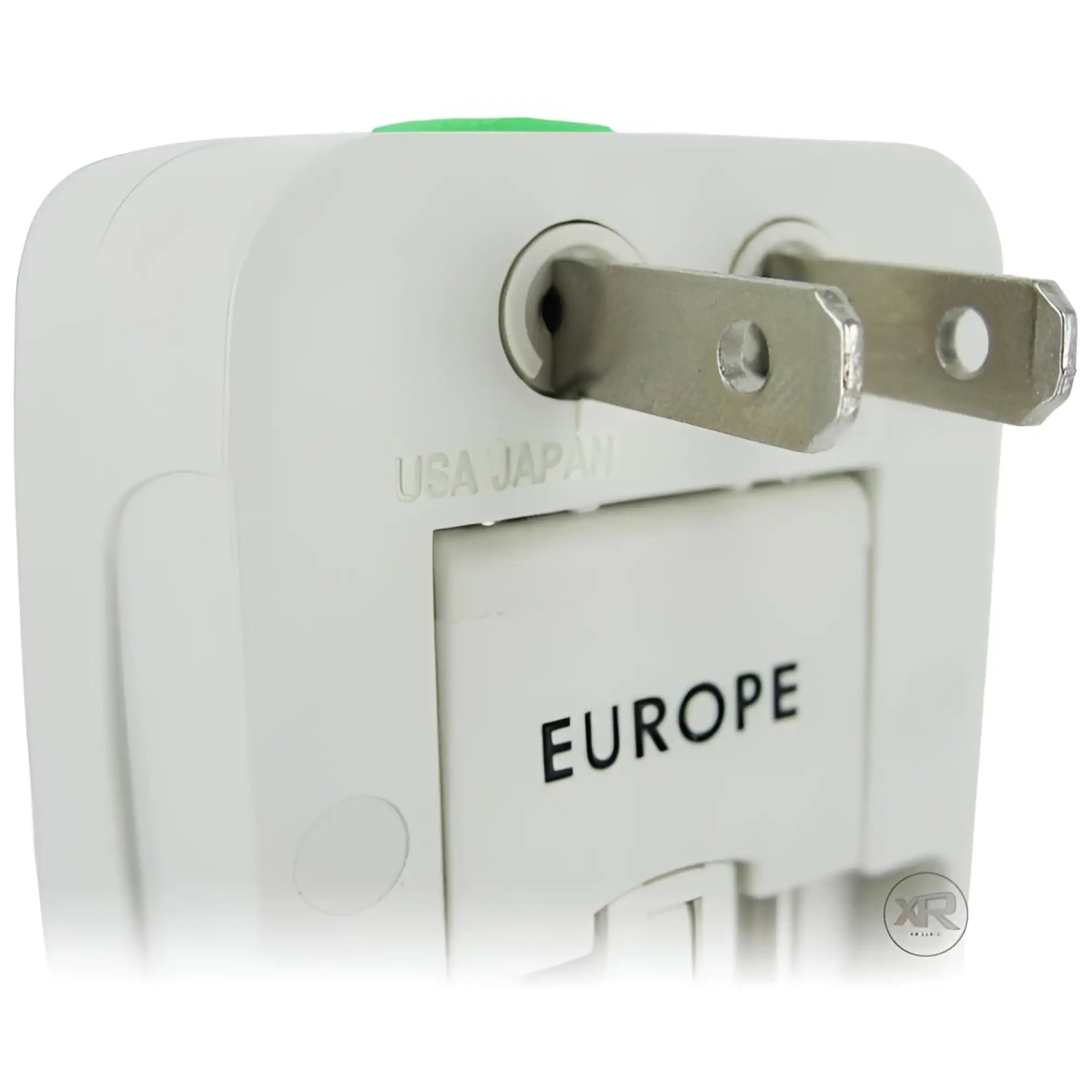 XR Brands white universal plug adapter with USA/Japan prongs extended and labels for global regions.