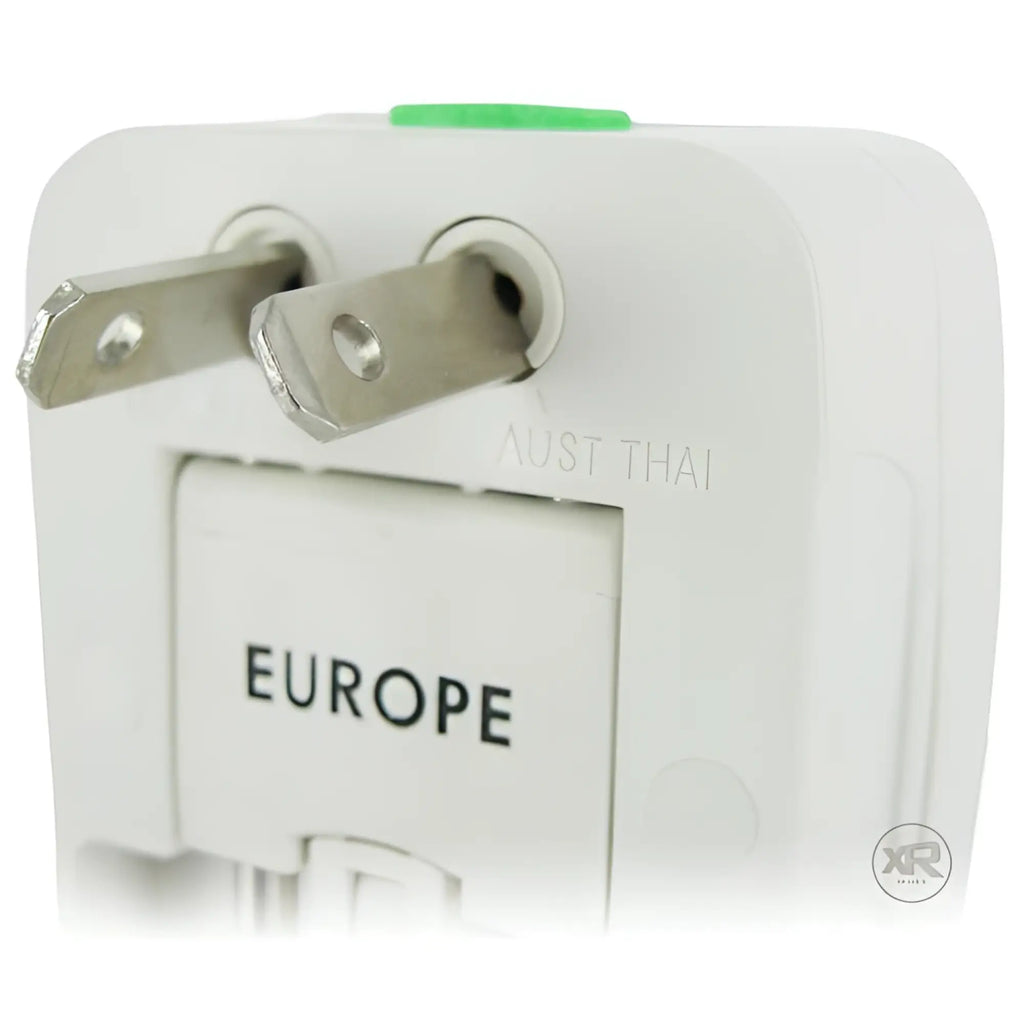 White XR Brands universal plug adapter with metallic prongs and "EUROPE" label visible on the side.
