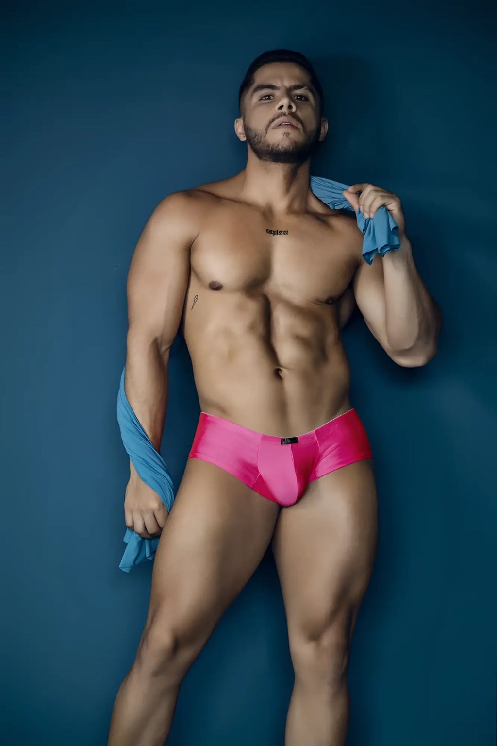 Vibrant pink xtremen 91234 microfiber trunks with sleek satin finish and black brand tag at waistband front view
